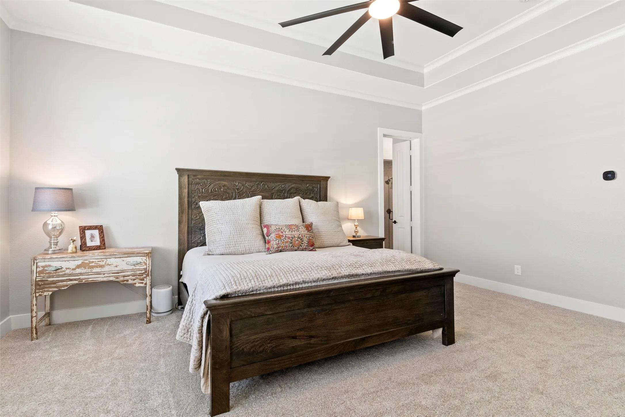 This primary suite has space for a sitting area to enjoy early morning quite time.