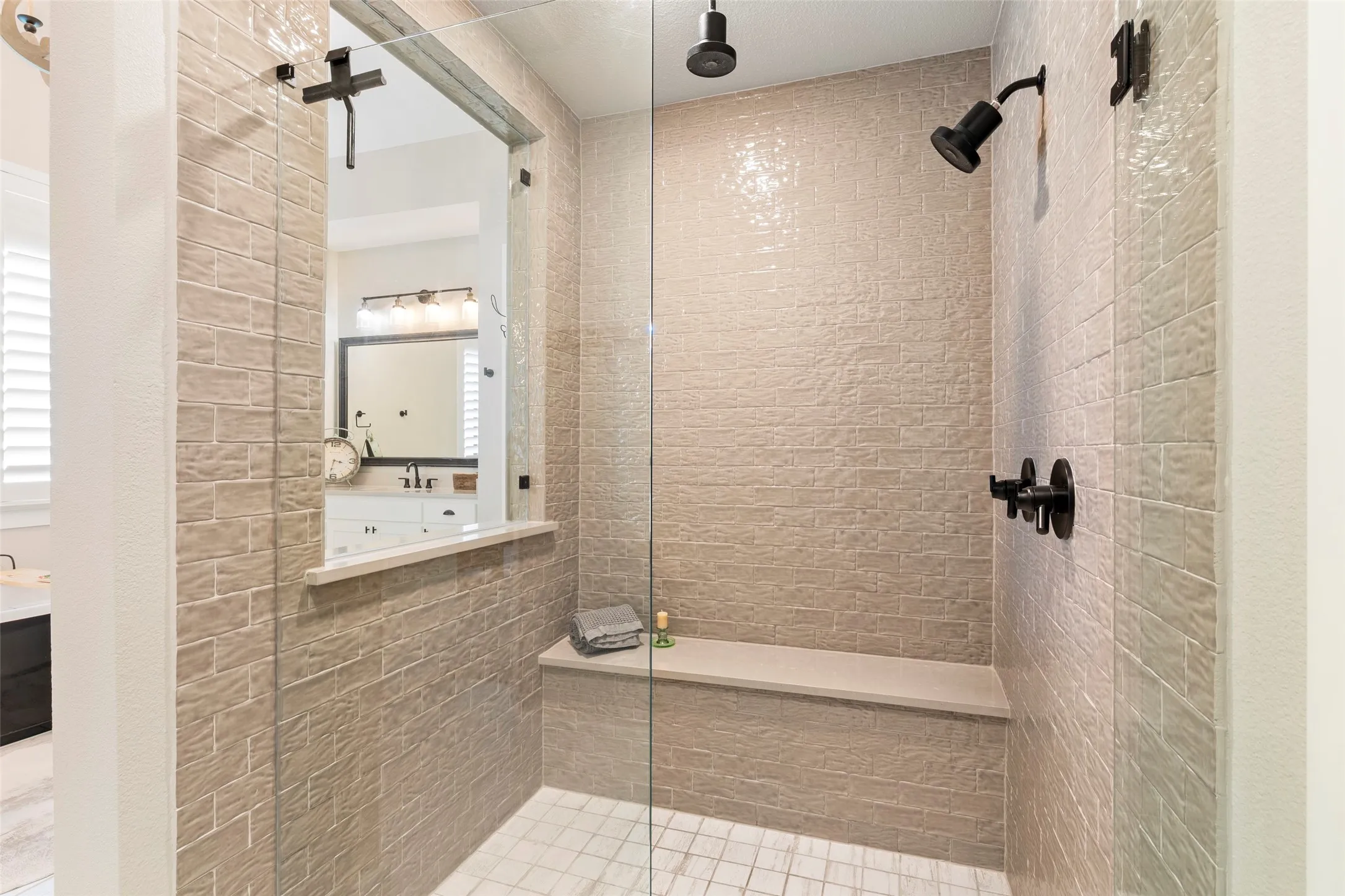 Large walk-in shower with a luxury overhead rainshower fixture.  Check out the california closets!