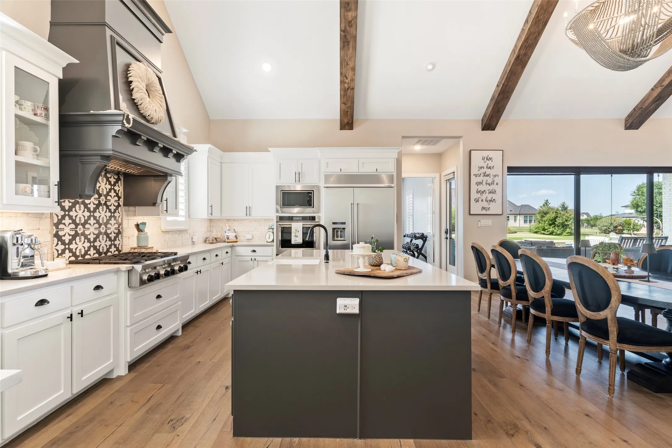 Quartz countertops, abundant storage and built-in refrigerator completes this custom kitchen.