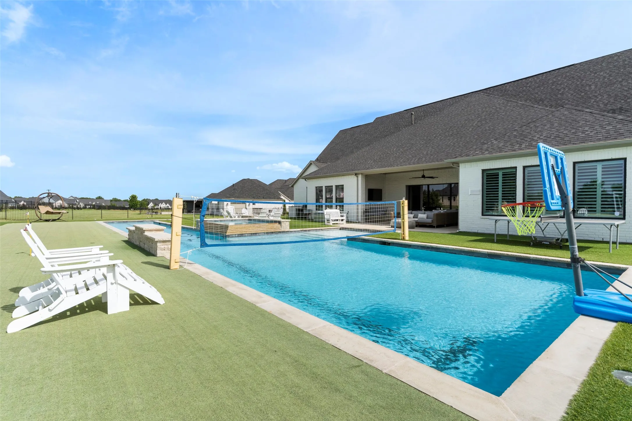 This "All-in-One" pool integrates a fitness lap pool with active water sports zones, a hot tub and tanning ledge.  There's something for everyone!