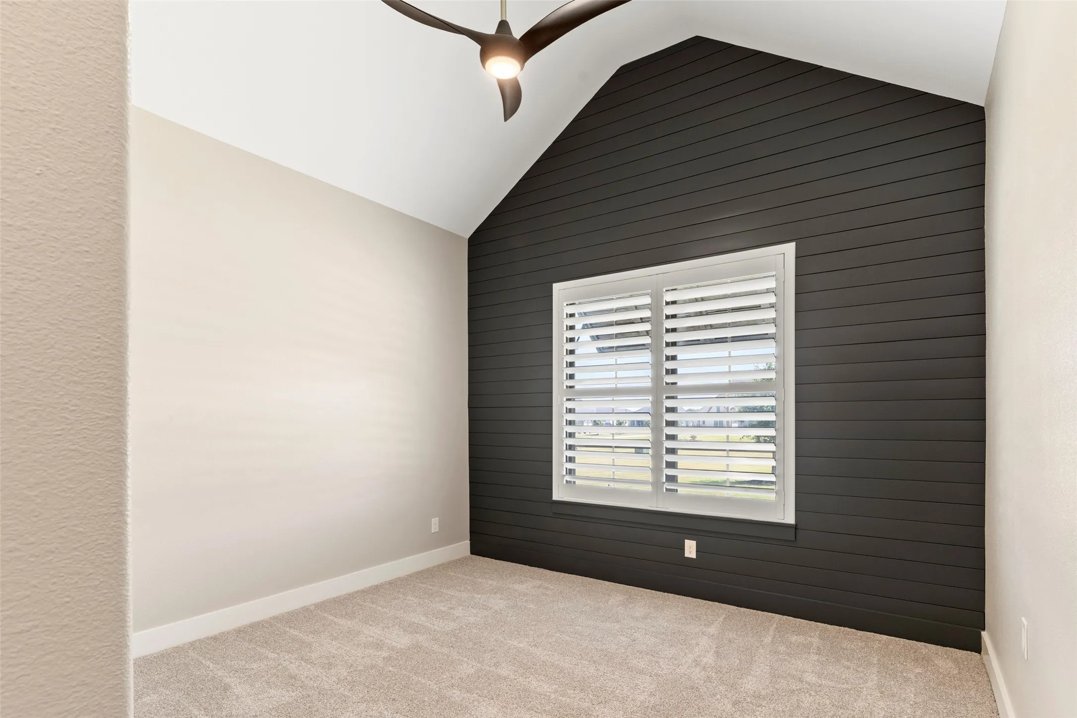 Bedroom #5 shiplap accent wall adds timeless architectural interest and classic farmhouse character.