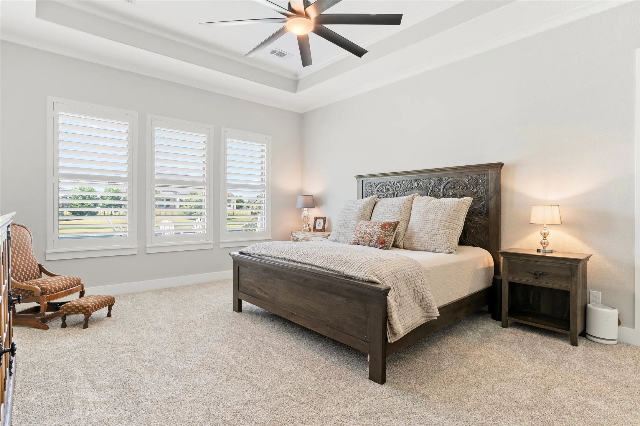 The primary suite is tucked away for privacy.