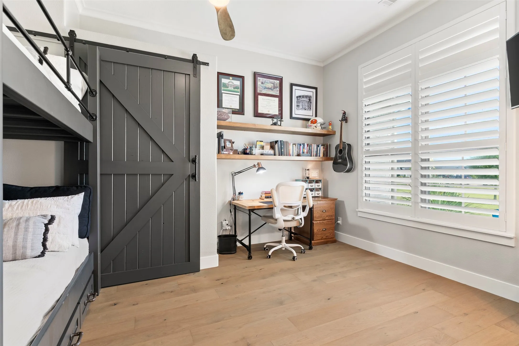 Bedroom #2 bunkbeds are a custom fit with custom barn doors and shelving.