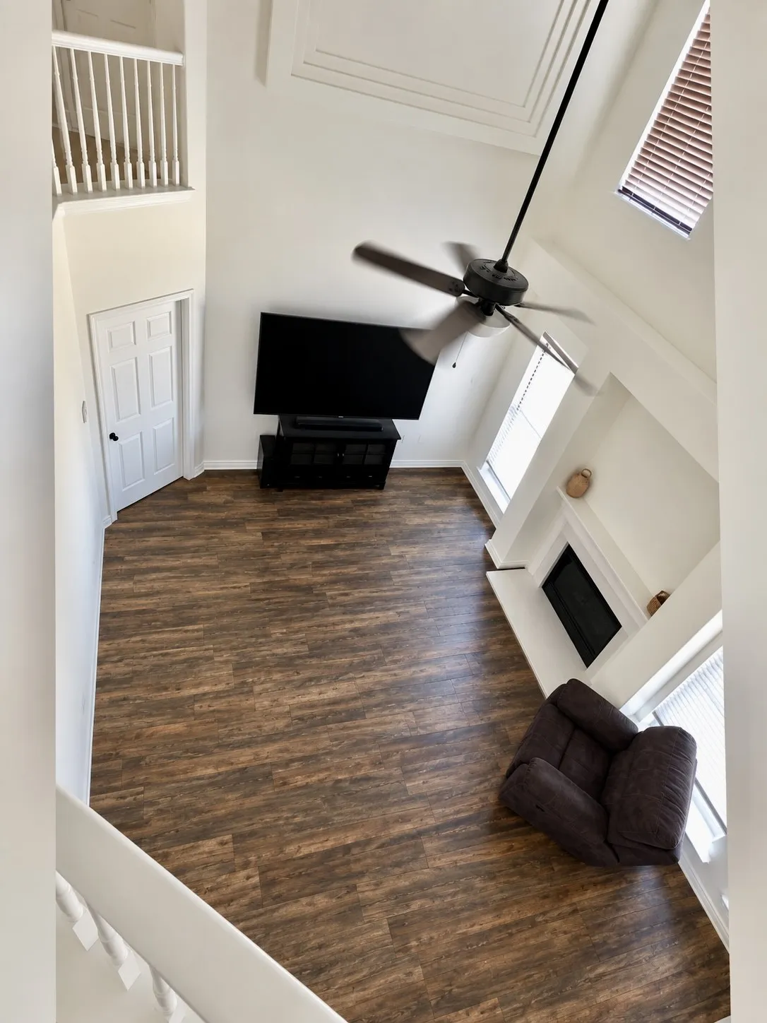Seller to install new flooring throughout entire downstairs, upon closing of acceptable offer. Buyer can pick color and must use sellers preferred flooring vendor. AI rendition of  new luxury vinyl plank!