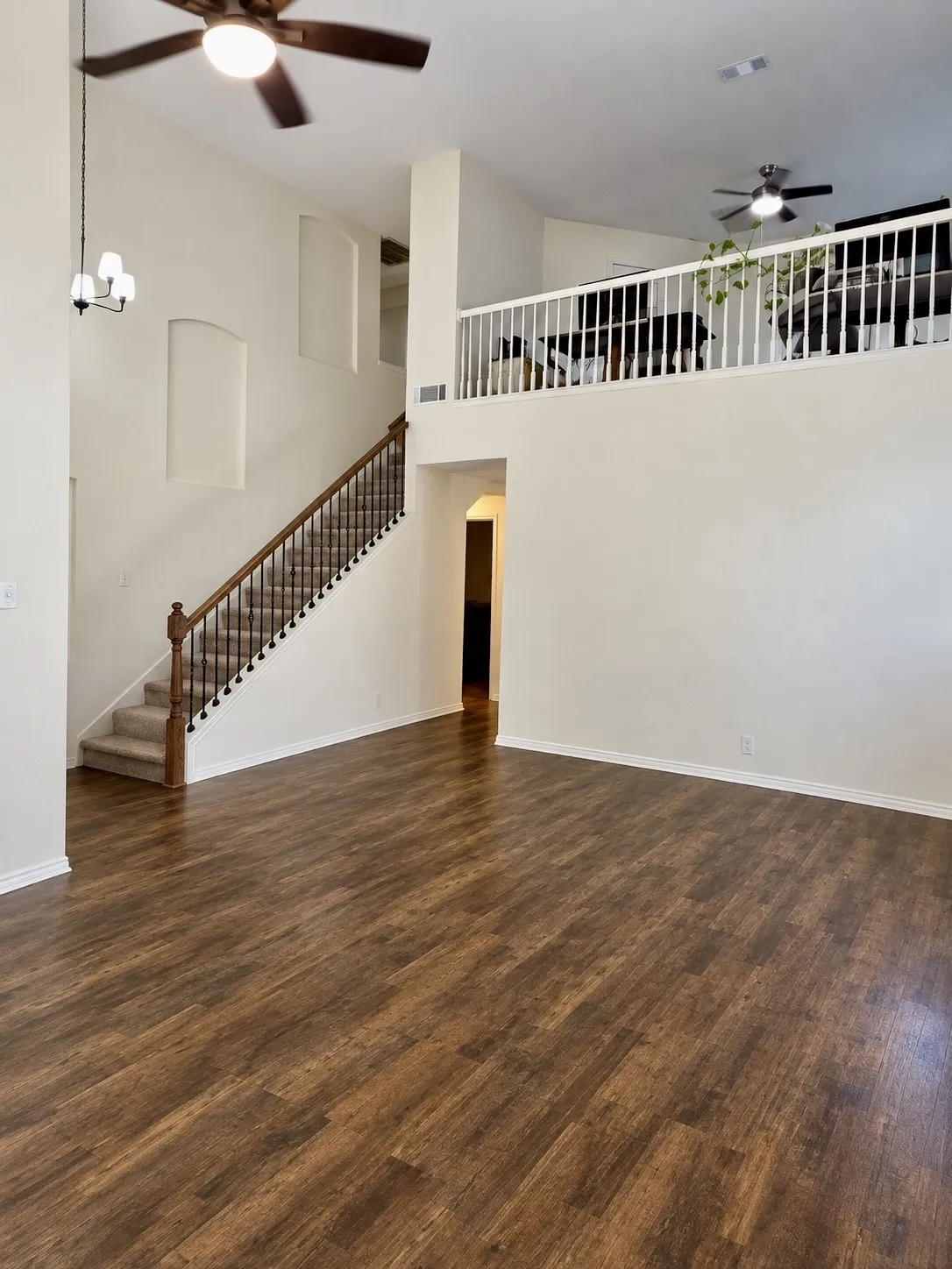 Seller to install new flooring throughout entire downstairs, upon closing of acceptable offer. Buyer can pick color and must use sellers preferred flooring vendor. AI rendition of  new luxury vinyl plank!