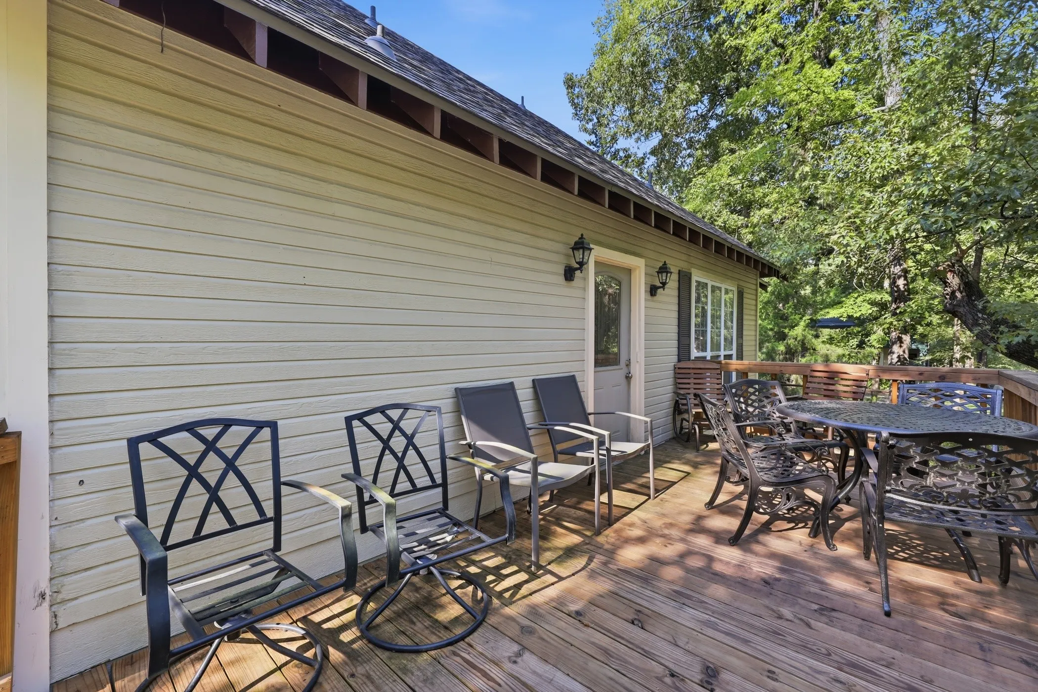 Expansive wood deck with a full-height railing