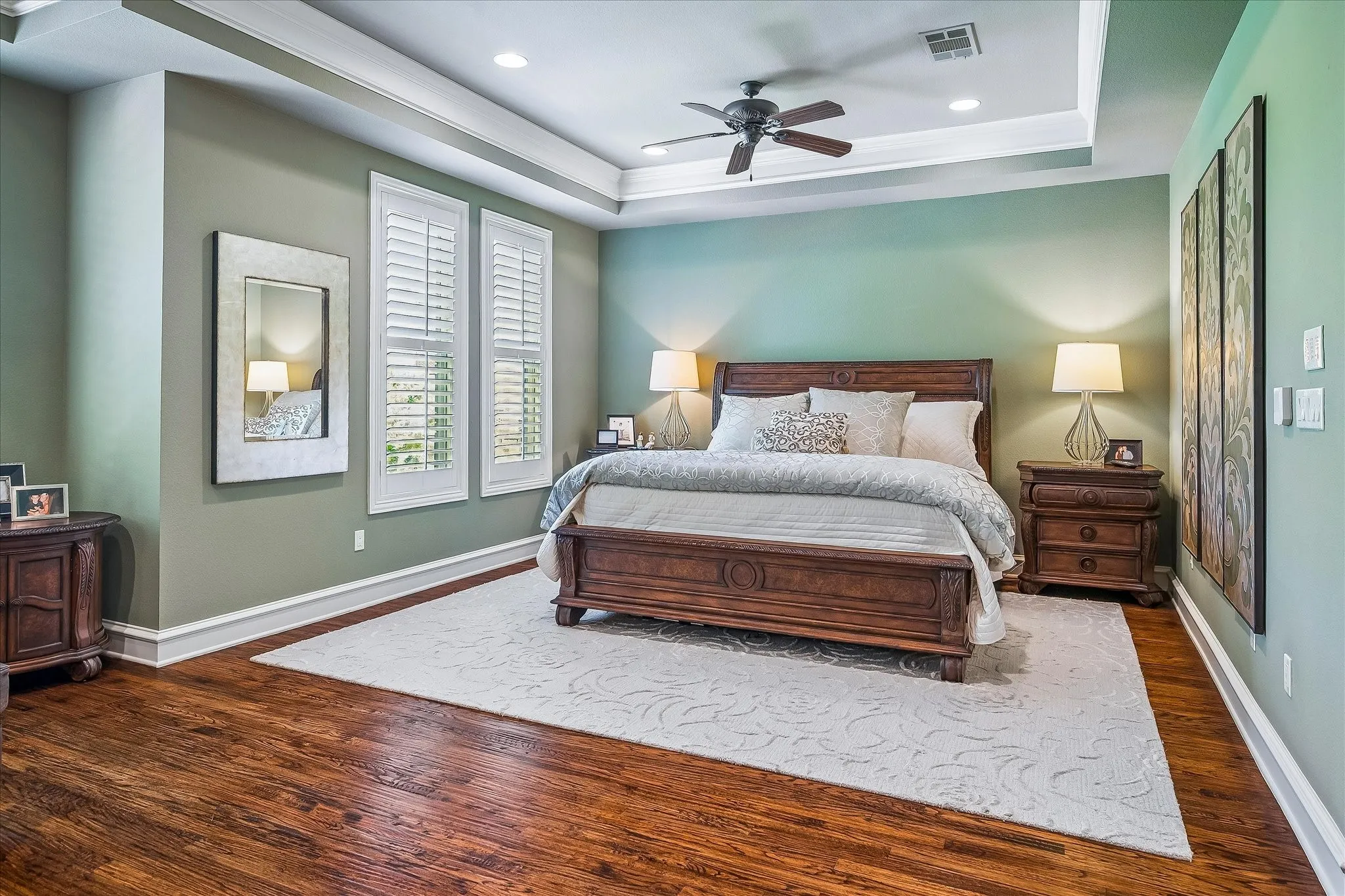 Huge Primary Bedroom, handscraped floors, trayed ceiling, windows overlook the park just across the street. Lots of natural light.