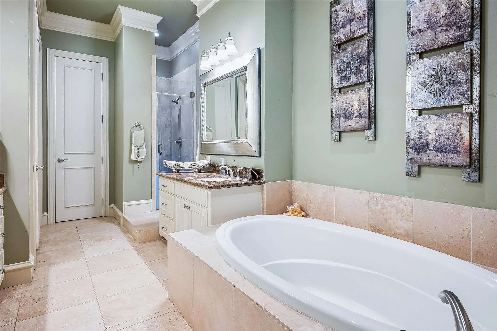 Primary Bathroom offers oversized soaking tub, walk in shower, separate vanities, linen closet, large walk in closet, toilet area.