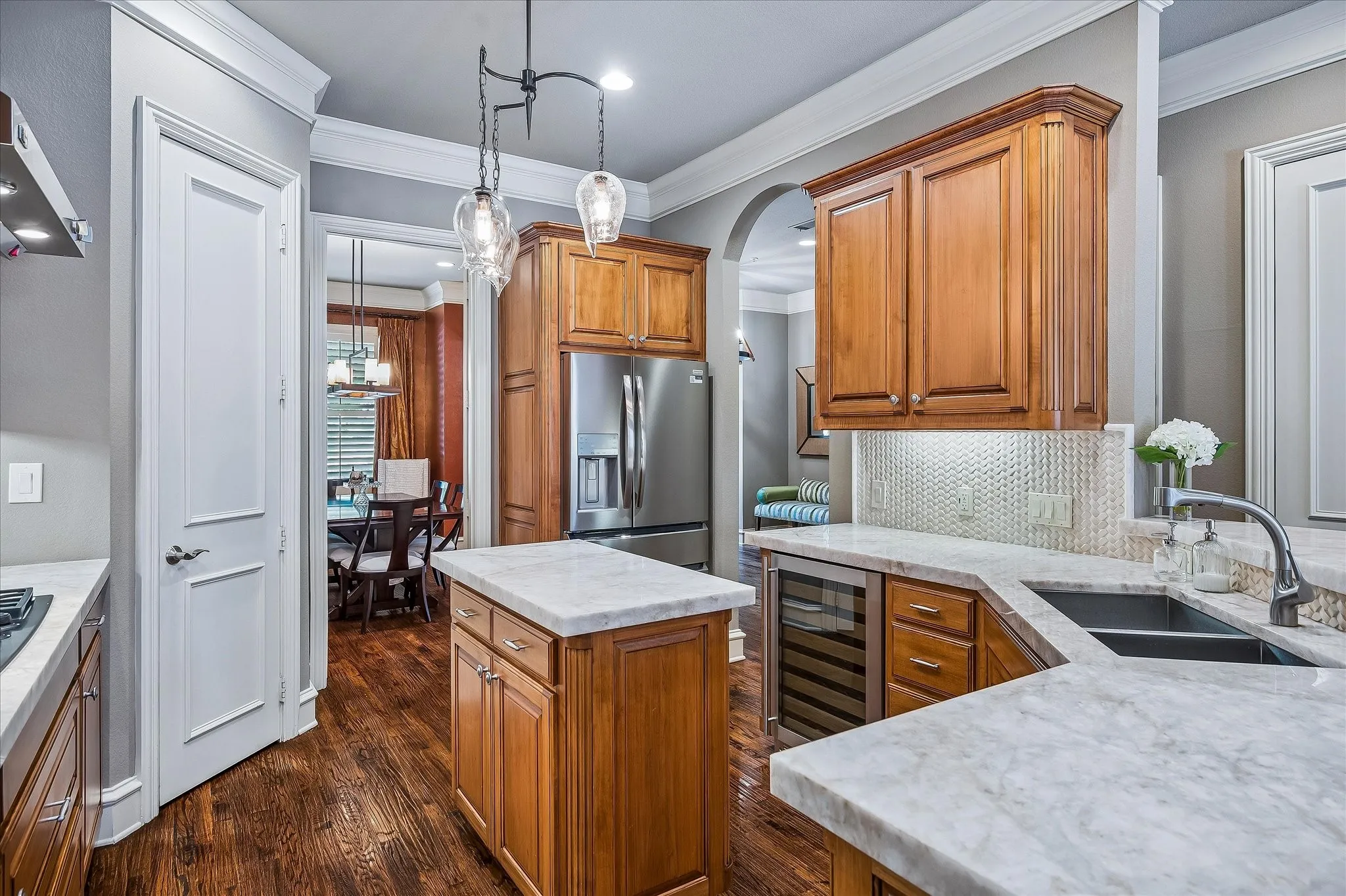 3 different entrances into the kitchen for nice flow. Braided stone backsplash.