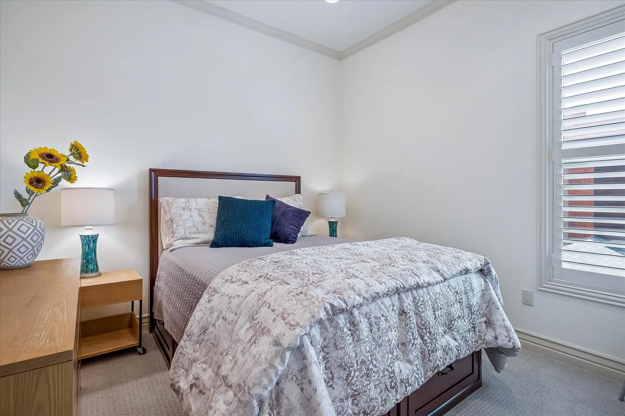 Second bedroom on second floor, window overlooks the courtyard.