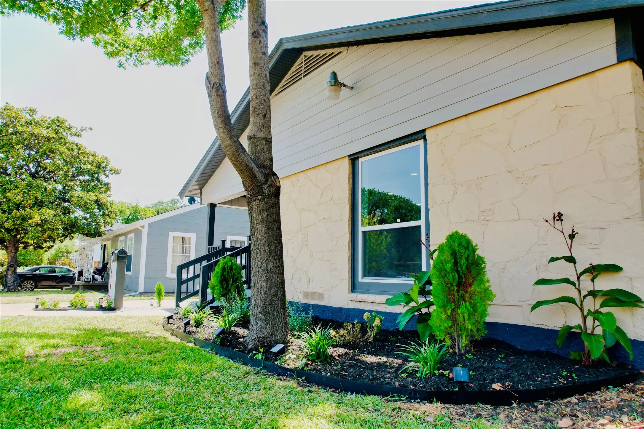 Exterior siding featuring a stone-look texture and horizontal paneling