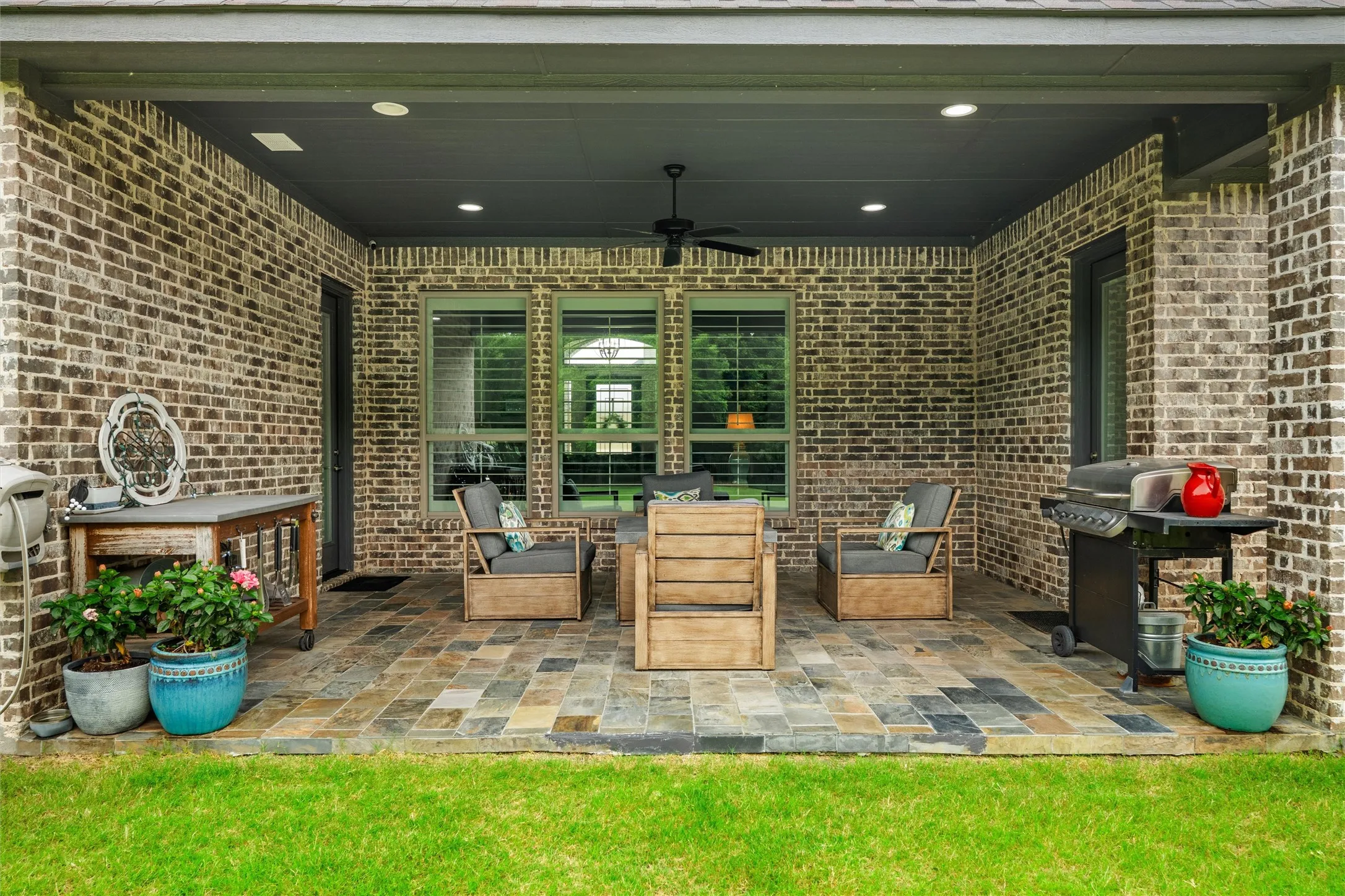 Your fully covered patio has slate tile and plenty of room to relax and enjoy the peaceful view and sounds of your back yard.