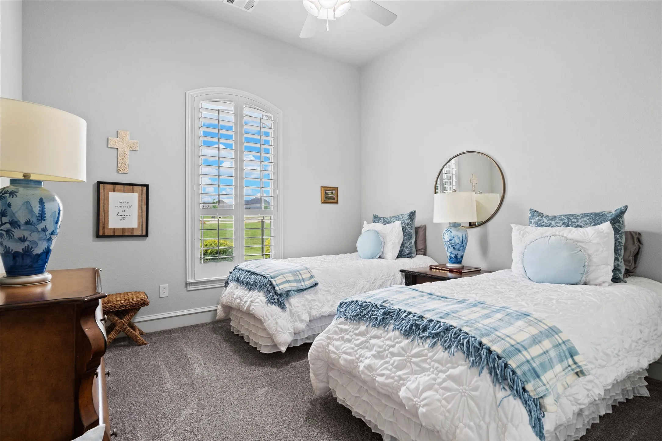 Secondary bedroom with two twins and a walk in closet.