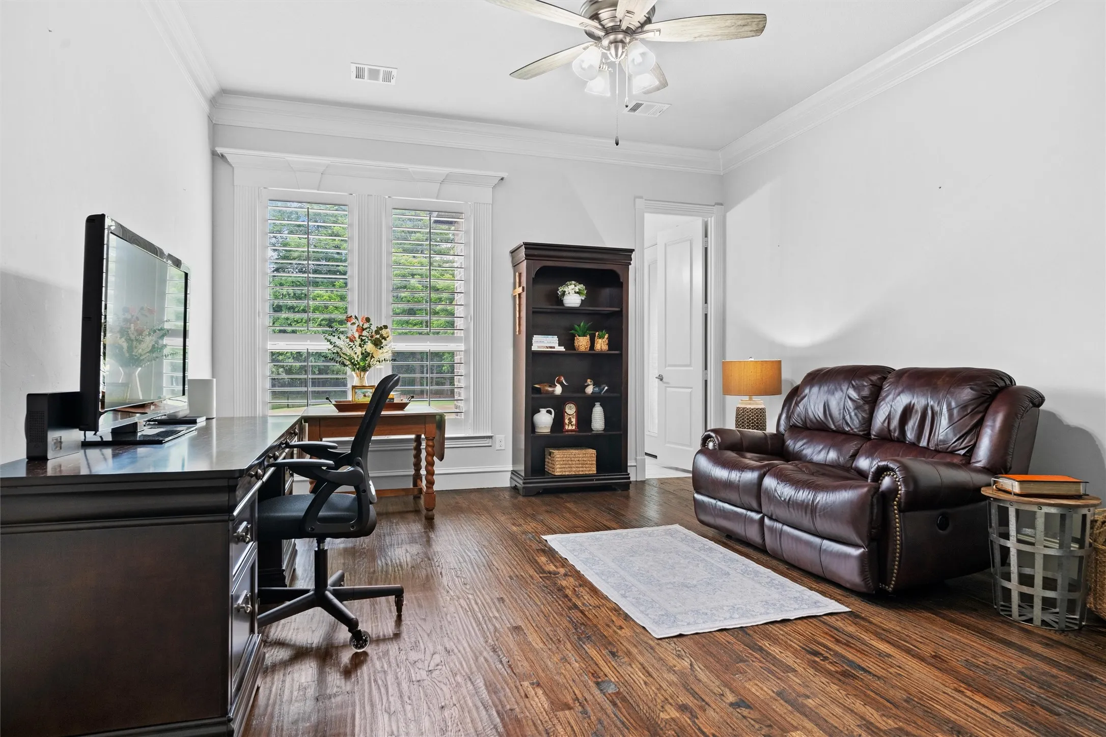 Spacious gameroom with attached half bath that exits to the back patio