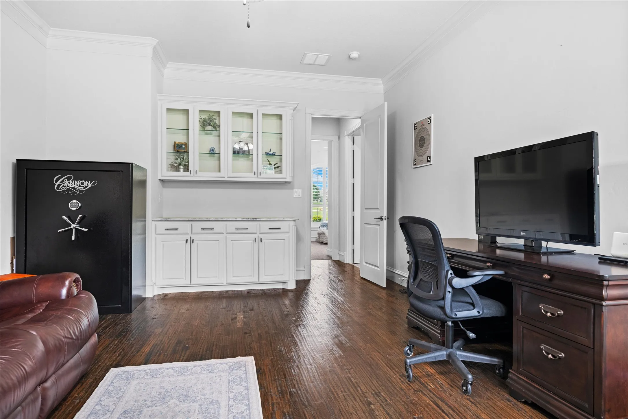Notice the dry bar with granite counters and custom cabinetry.