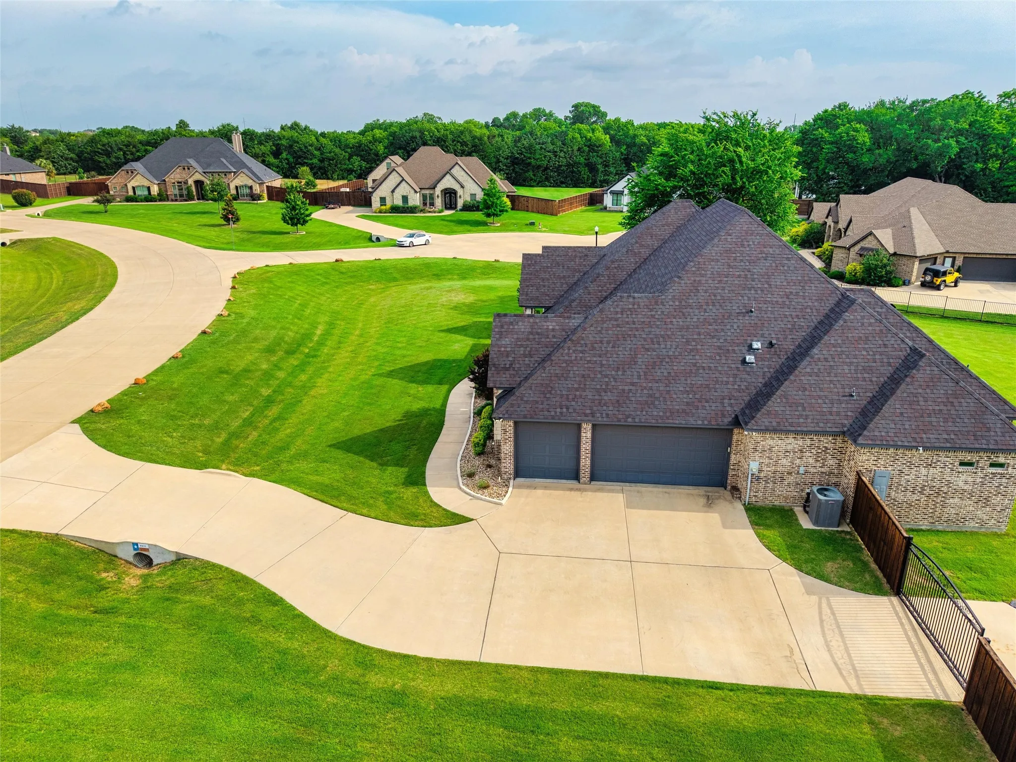 Plenty of extended parking and a gate to with a paved area to park your trailer, boat, or small RV.