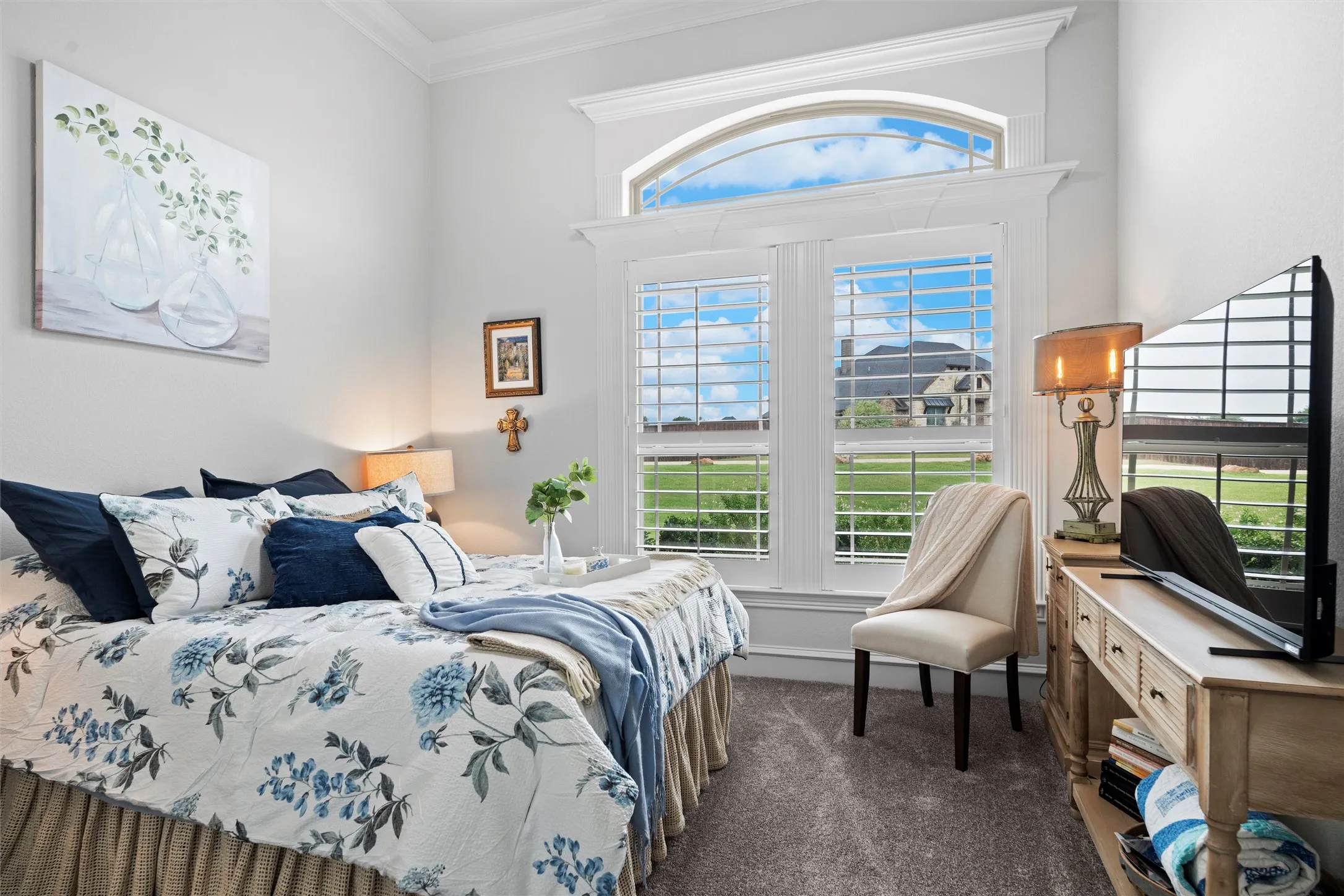 This secondary bedroom has a queen bed and walk in closet.