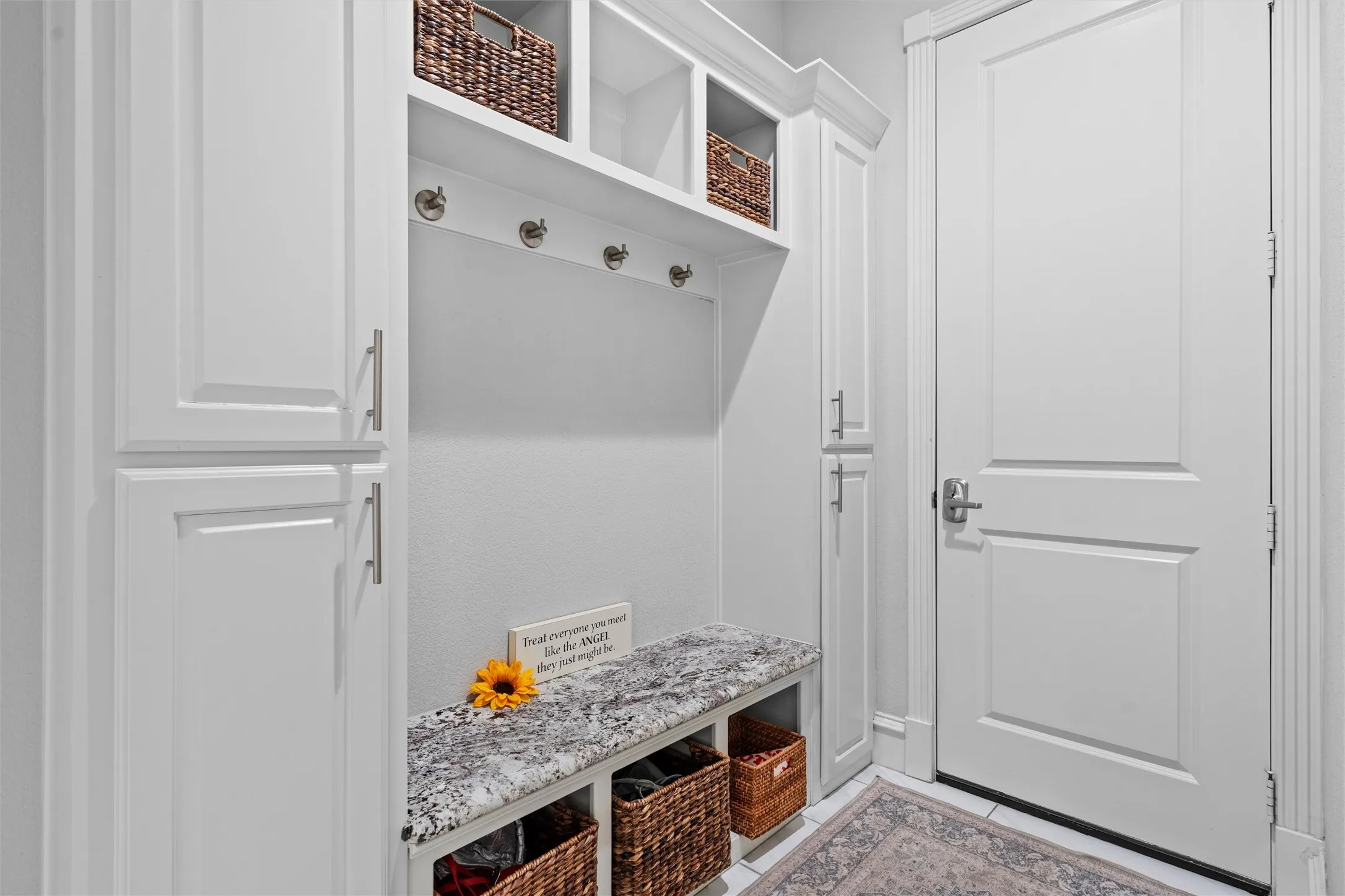You will not run out of storage in this home! This is the mudroom that opens to the 3 car garage that has epoxy floors.