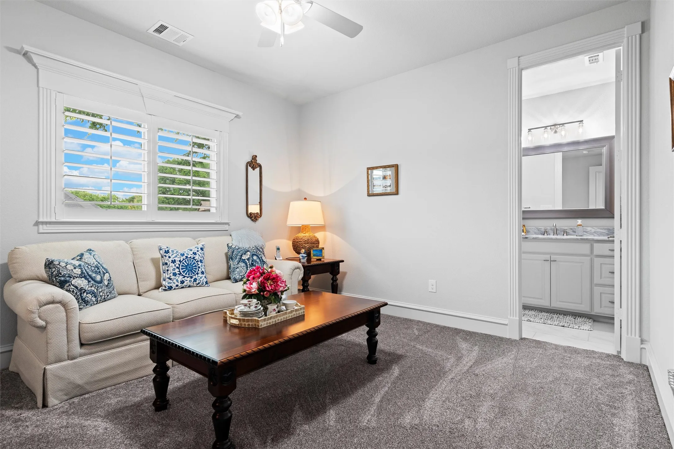 Secondary bedroom with an ensuite bath and walk in closet, currently being used as a study/sitting room.