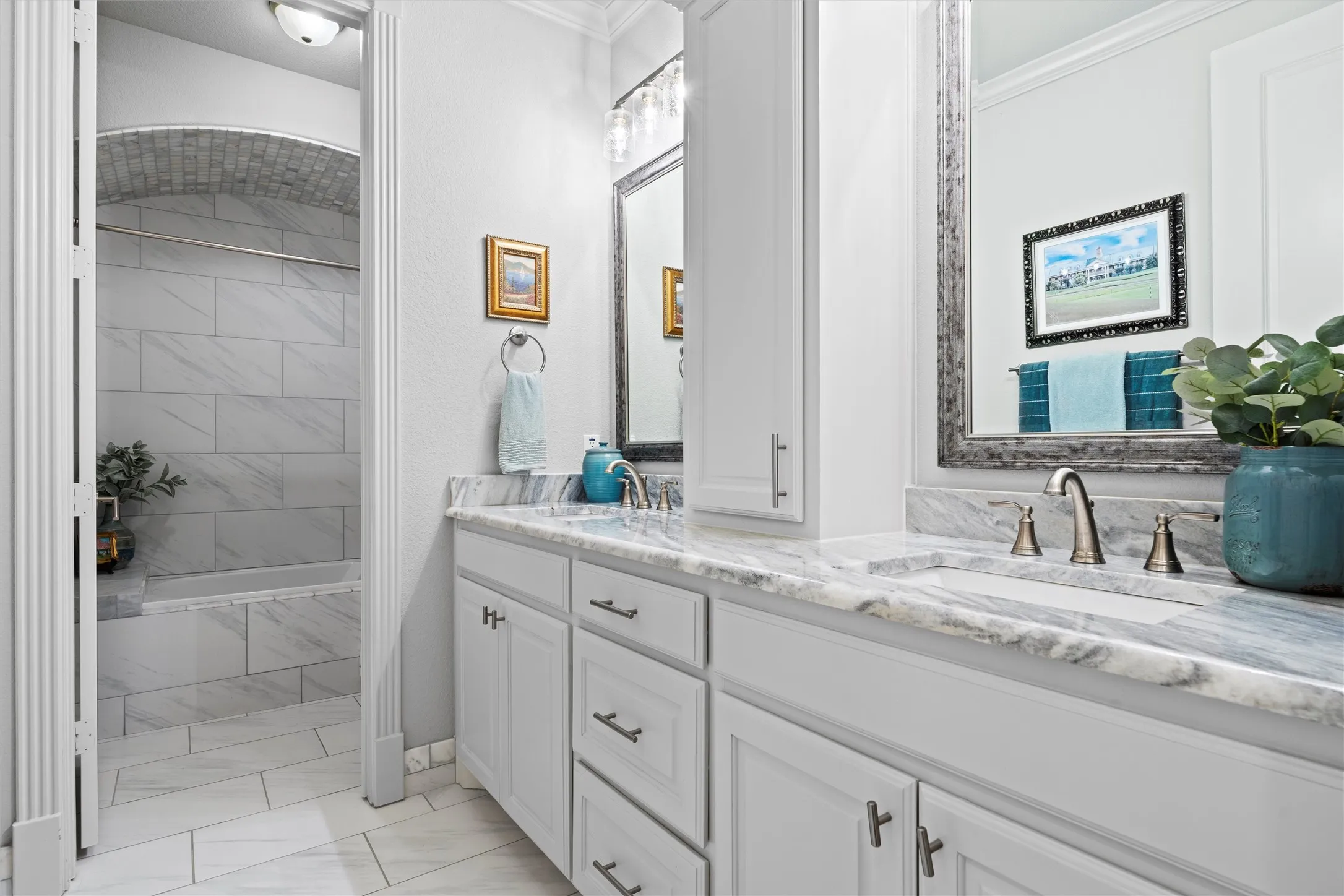 Full bath for two of the secondary bedrooms. Notice the gorgeous tile work on the ceiling of the shower/tub area.