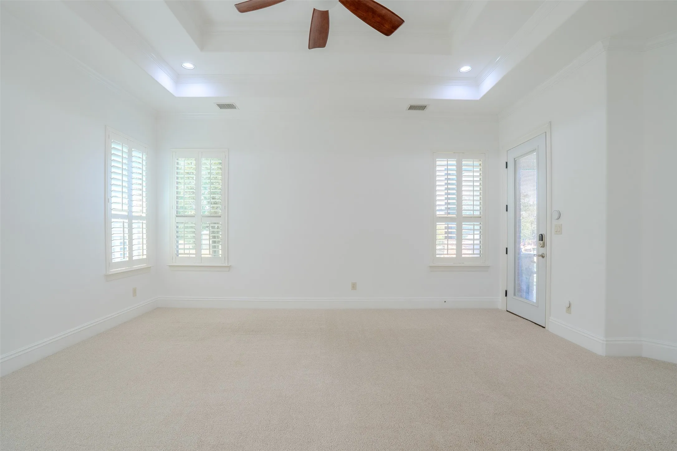 Primary bedroom with access to the patio