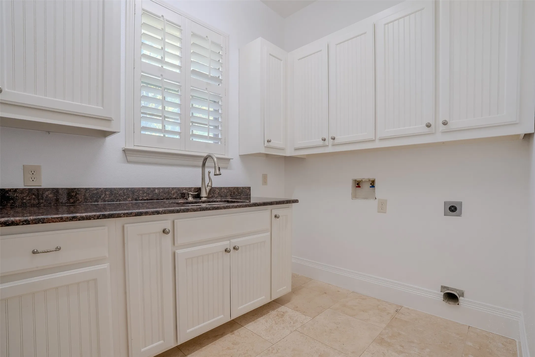 Large laundry room with sink