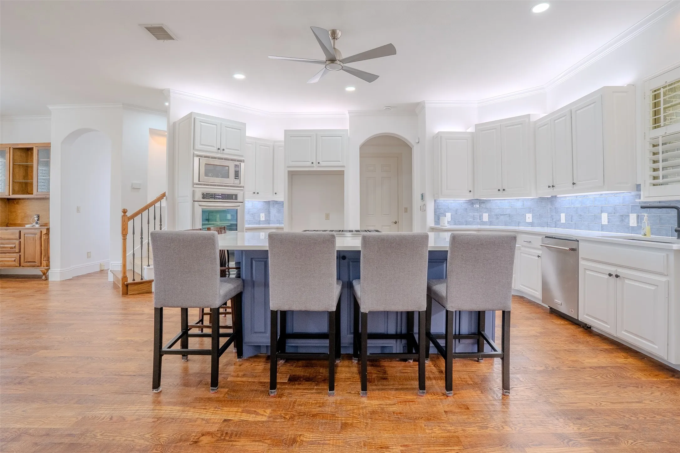 beautifully remodeled kitchen with stainless appliances and Wolf stovetop