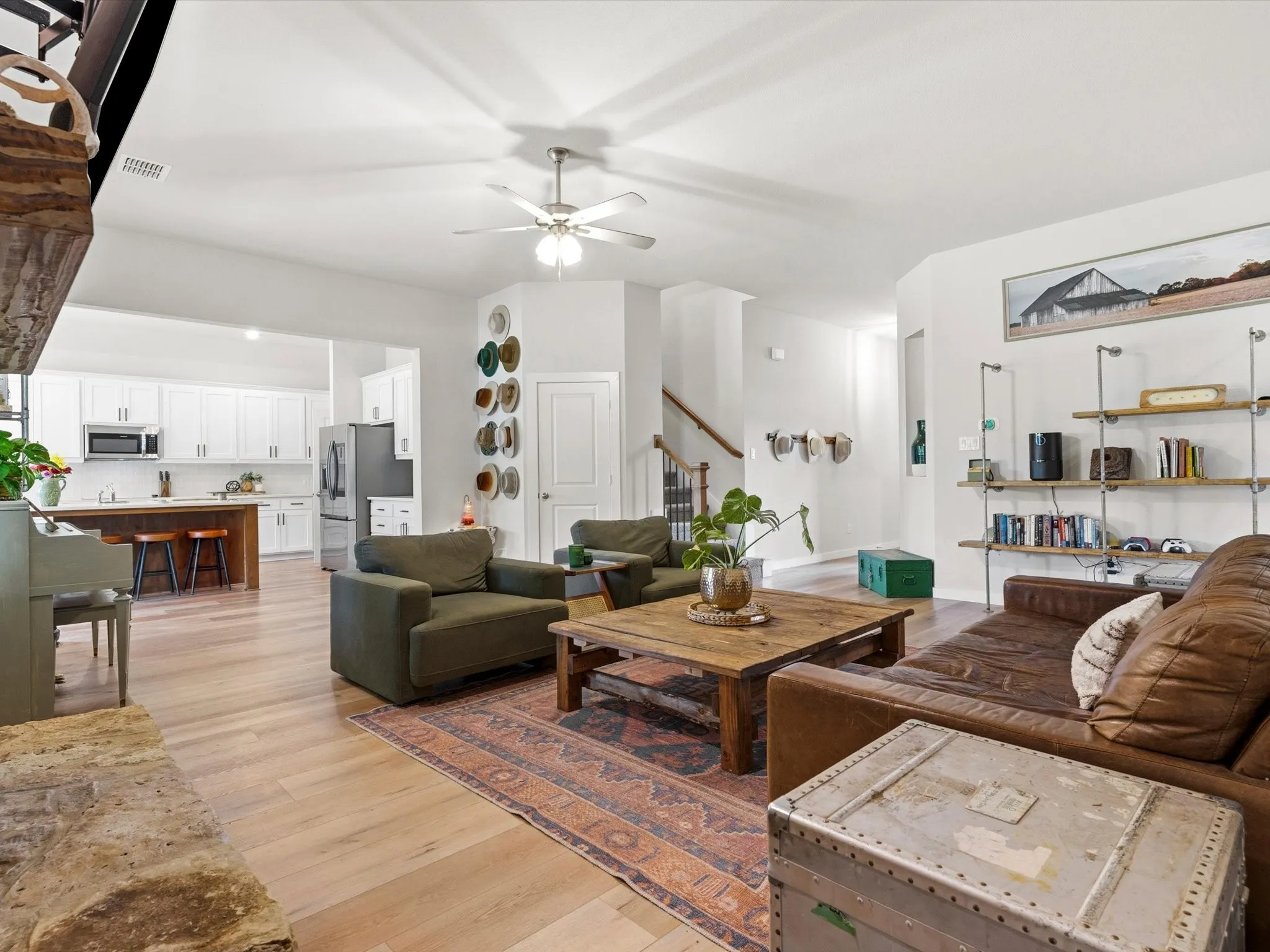 Spacious open-concept living room filled with natural light and designed for comfortable everyday living and entertaining.