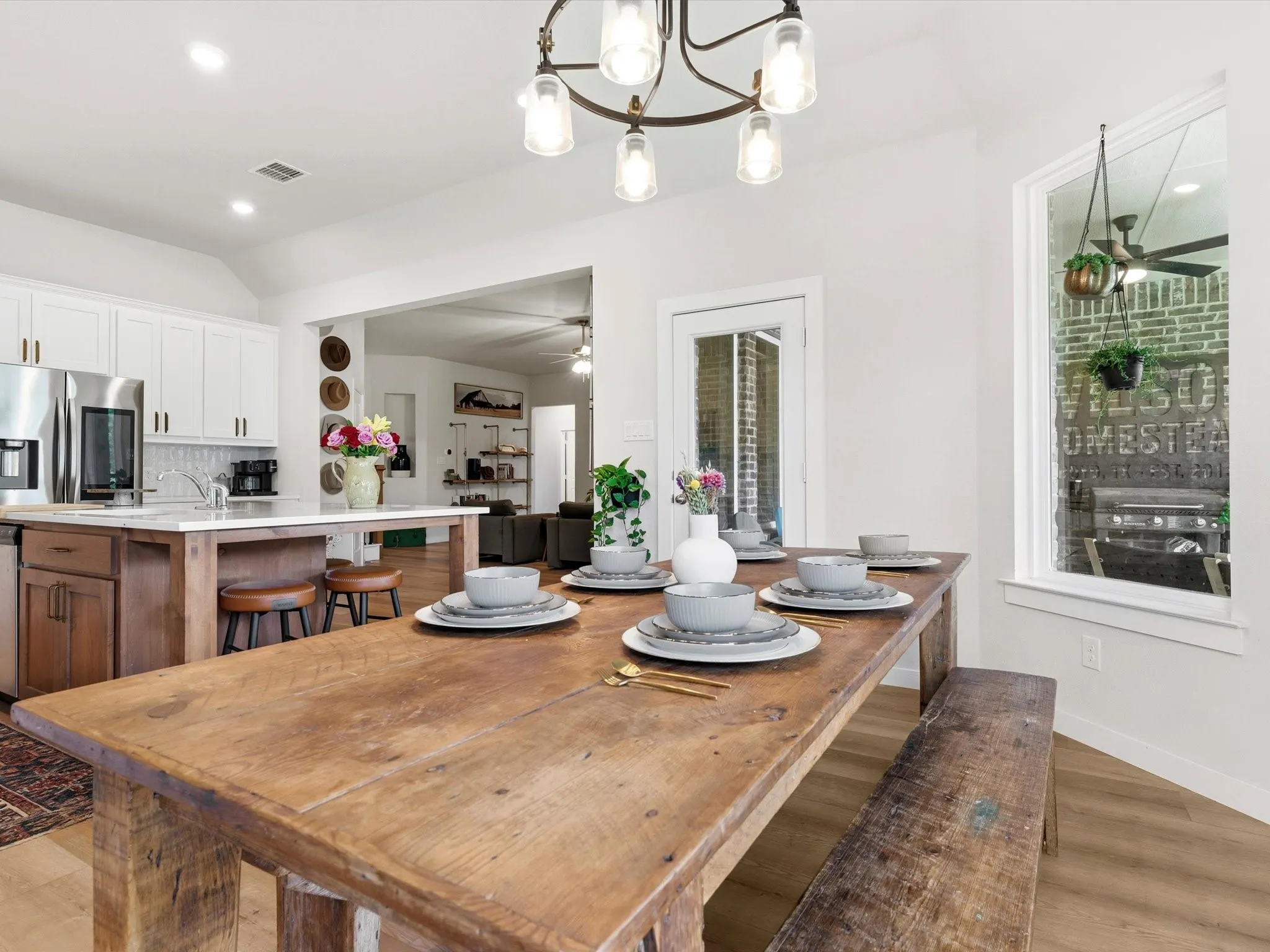 Light-filled dining area offering views of the backyard and easy access to the covered patio