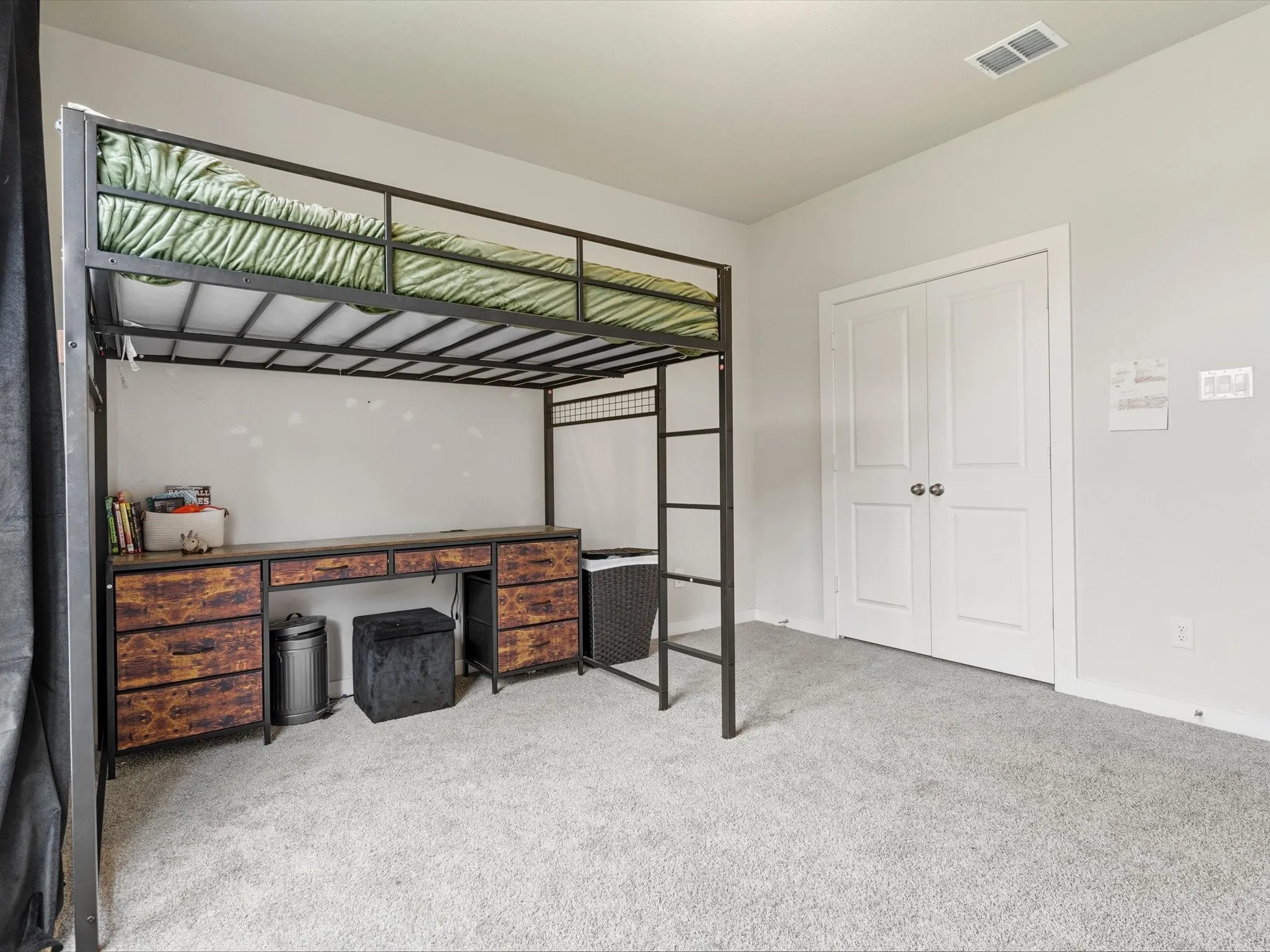 Additional downstairs bedroom offering flexibility for family, guests, or hobbies.