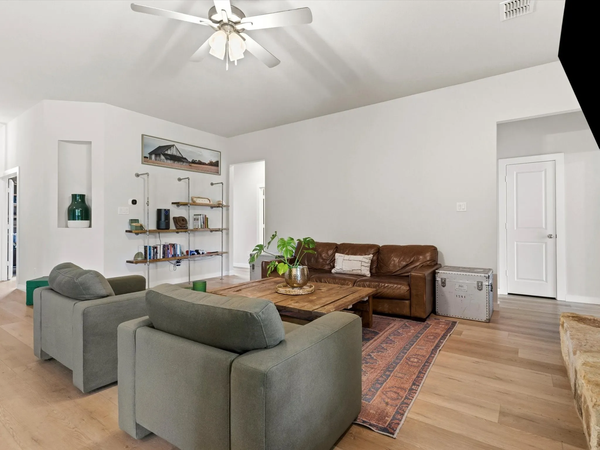 Open living area seamlessly connected to the kitchen and dining spaces, creating an ideal gathering place.