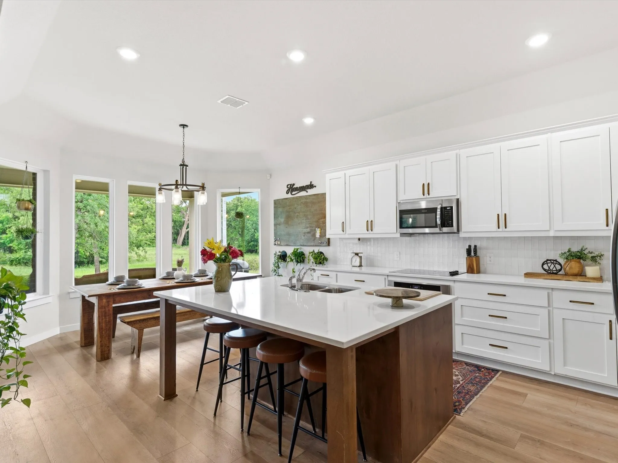 Large center island provides additional seating, meal preparation space, and a natural gathering spot.