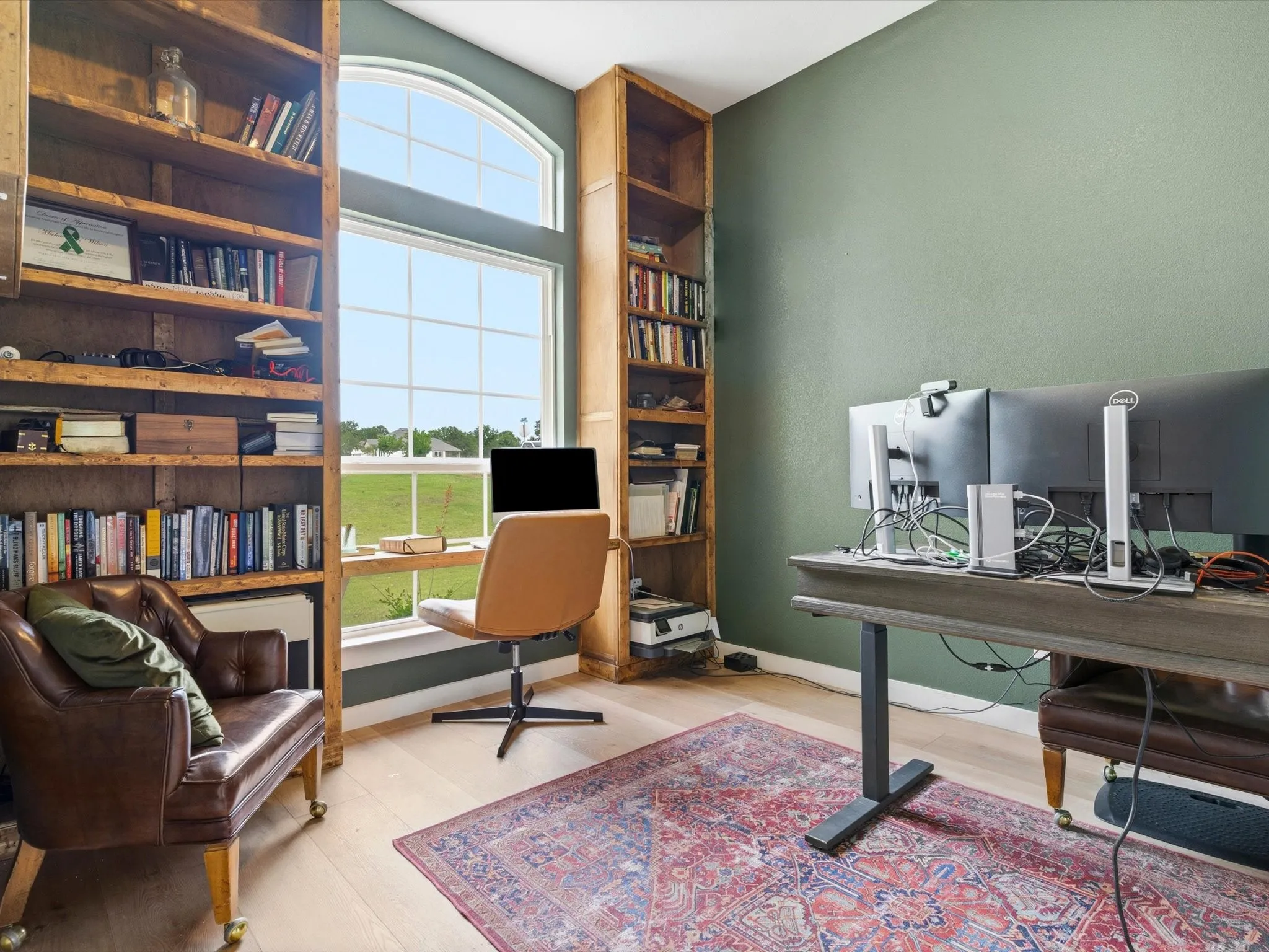 Private executive office with custom built-in cabinetry, ideal for working from home, studying, or managing everyday tasks.