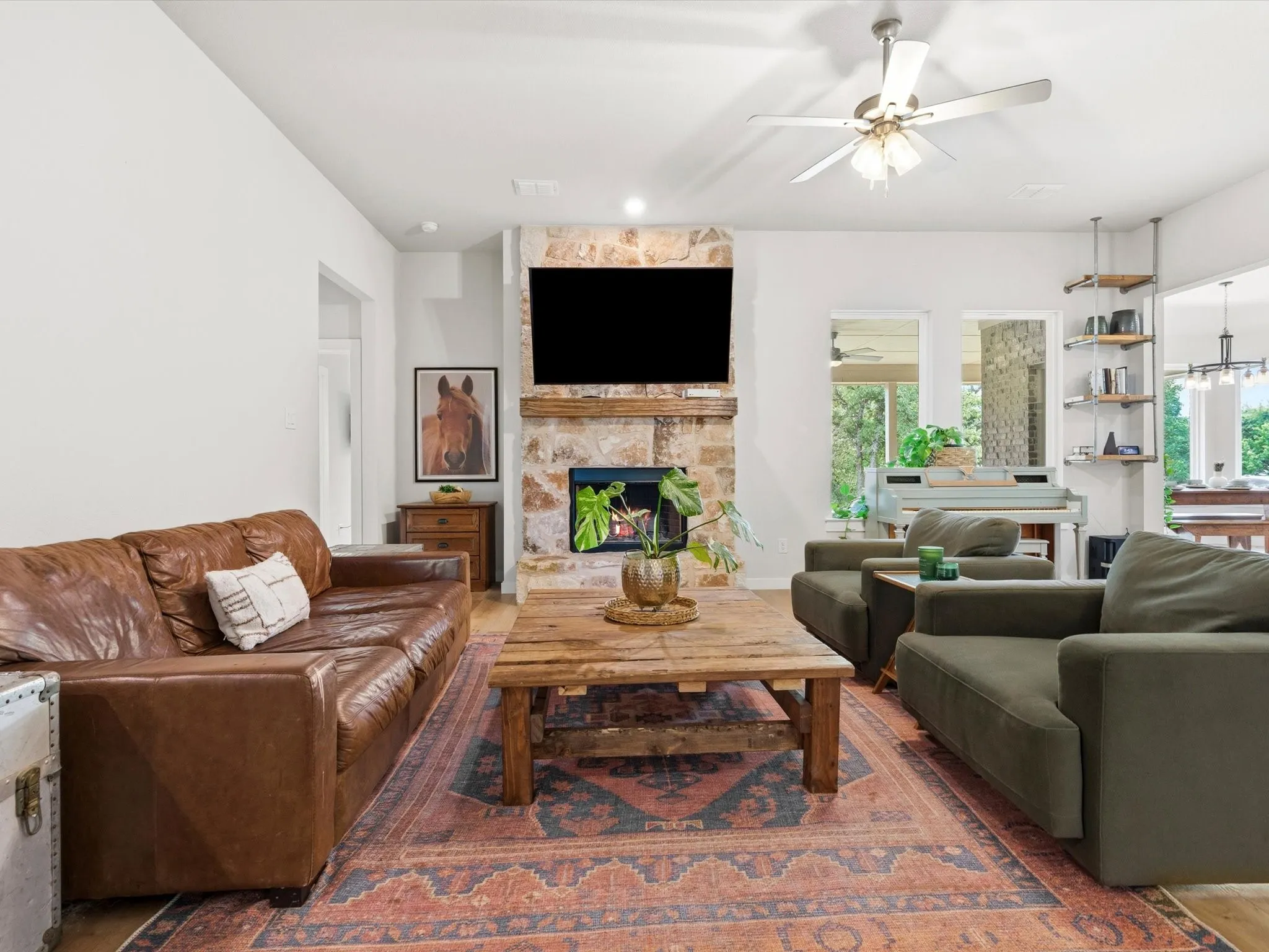 Open living area seamlessly connected to the kitchen and dining spaces, creating an ideal gathering place.