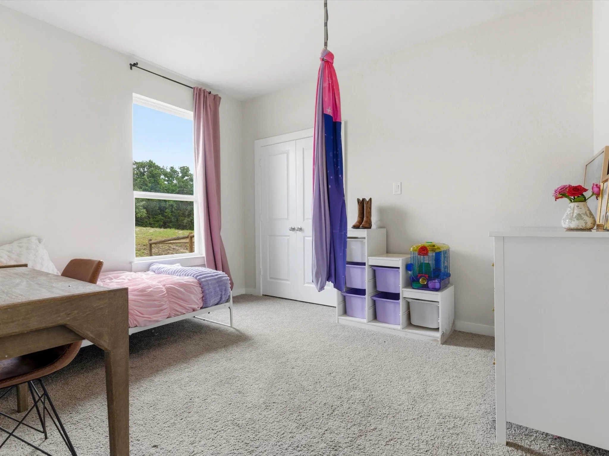 Comfortable secondary bedroom located on the first floor with convenient access to a full bathroom.