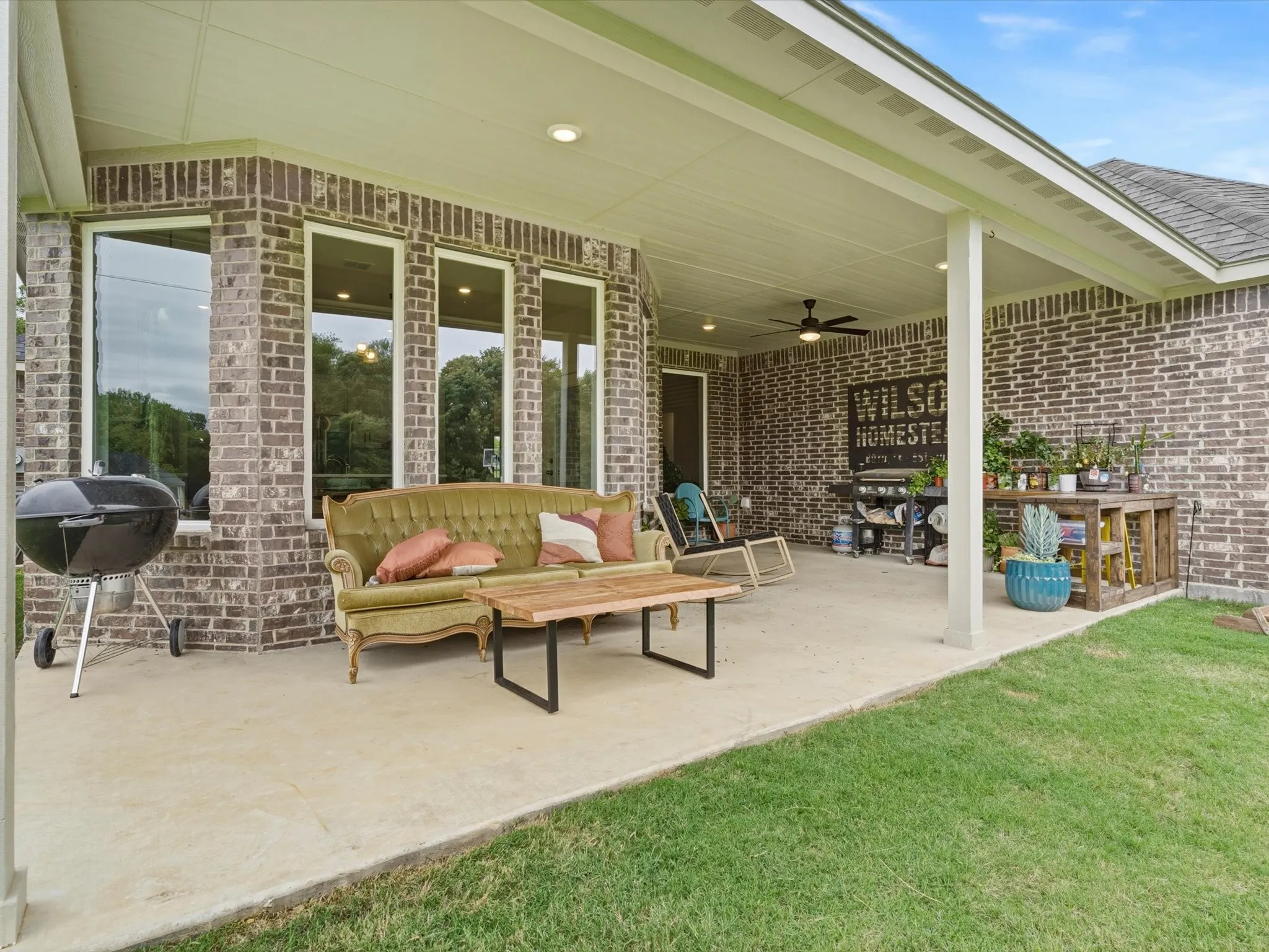 Expansive covered patio designed for outdoor dining, entertaining, and relaxing while enjoying peaceful country views.