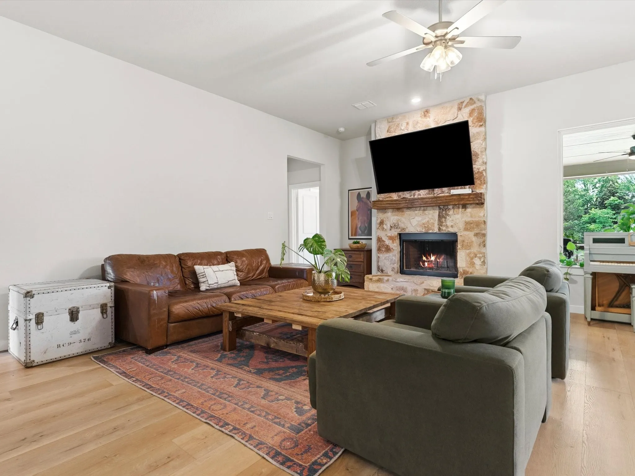 Spacious open-concept living room filled with natural light and designed for comfortable everyday living and entertaining.