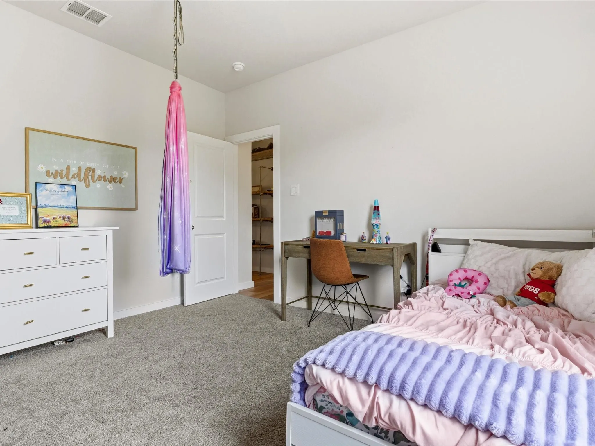 Comfortable secondary bedroom located on the first floor with convenient access to a full bathroom.