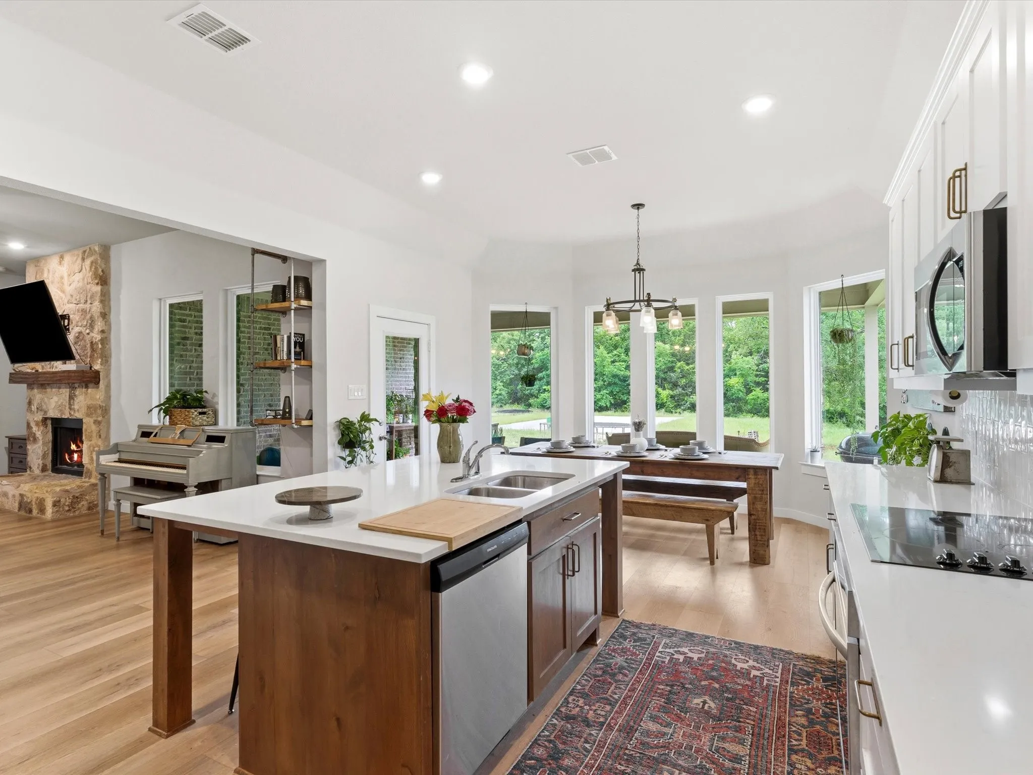 Beautifully appointed kitchen with abundant cabinetry, generous prep space, and an open layout overlooking the main living area.
