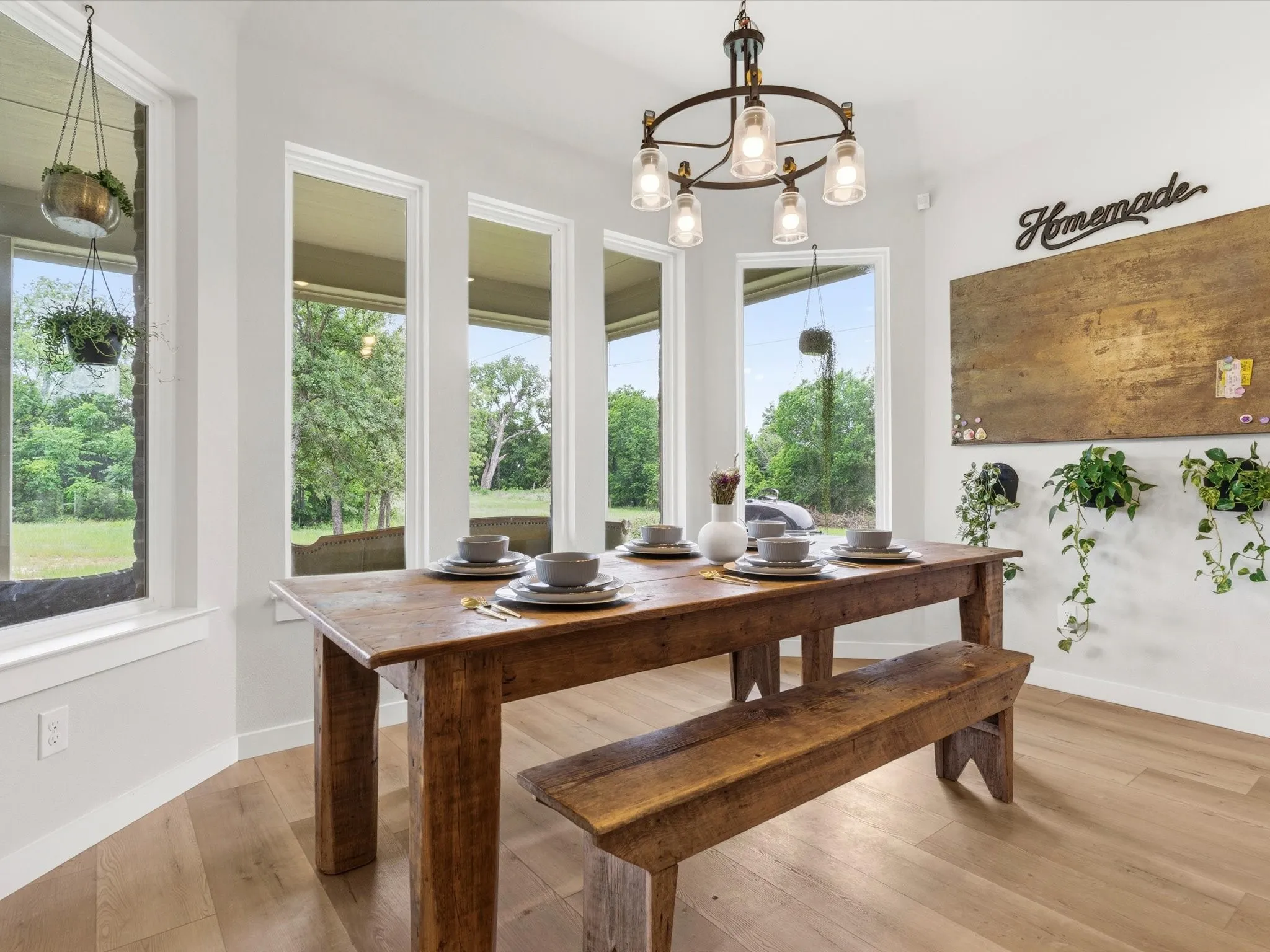 Light-filled dining area offering views of the backyard and easy access to the covered patio