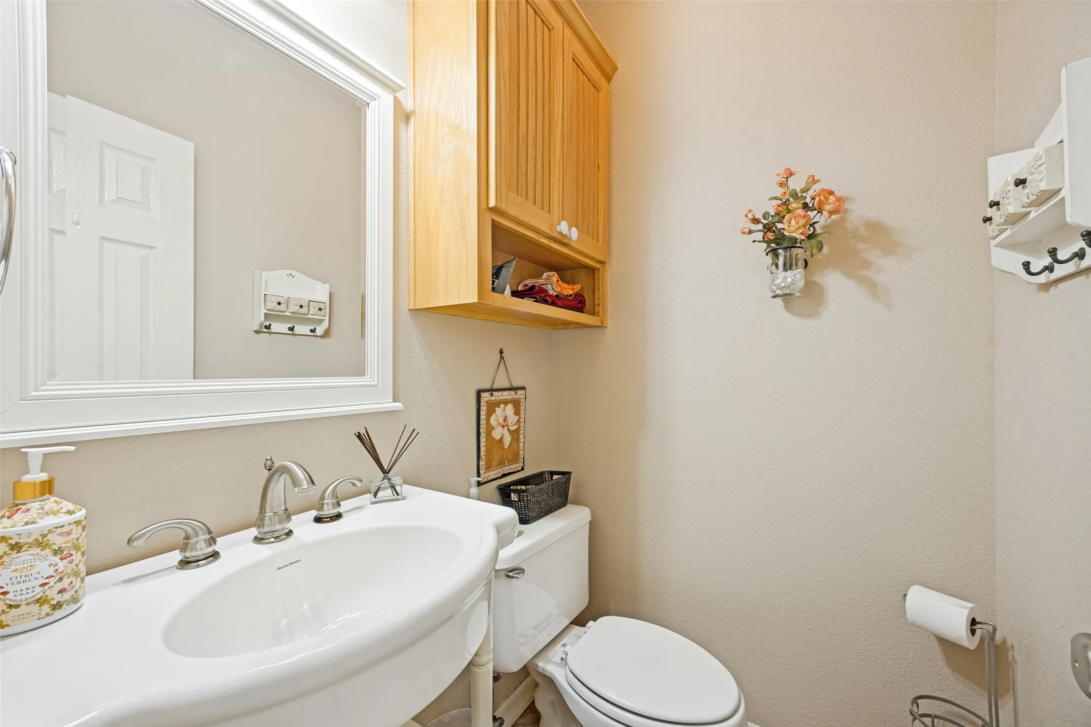 This half bath is tucked away just off the kitchen.