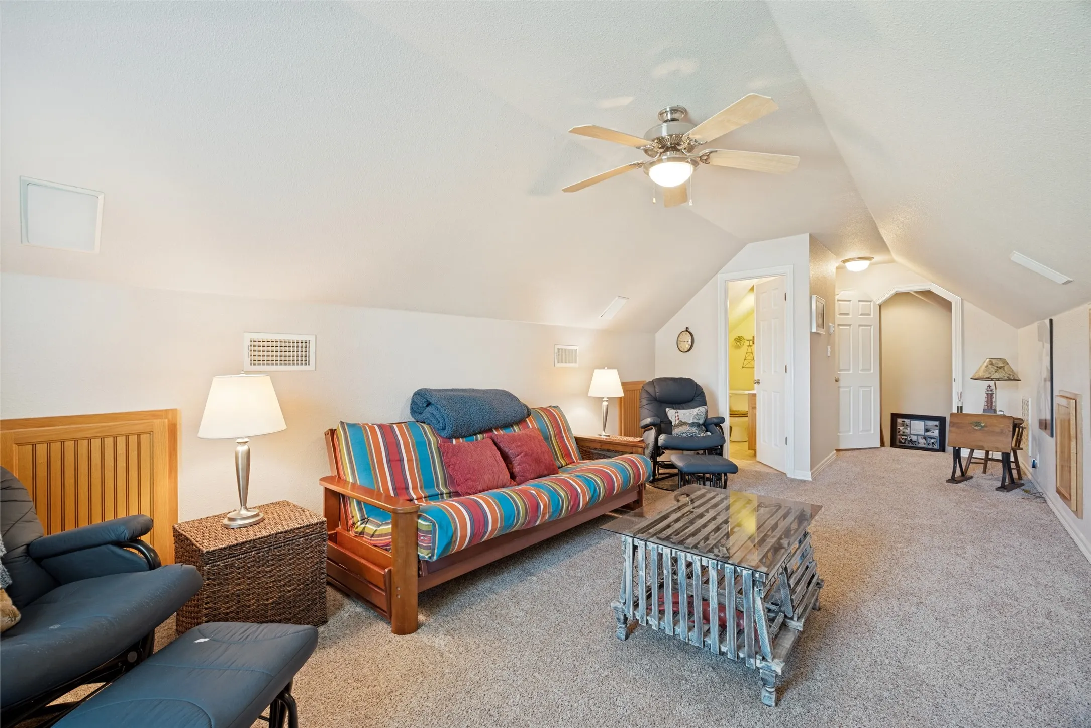 Complete with its own half bath, this space would make a great spot for sleepovers, game nights or business meetings. Just behind the door is walk-in attic access, too!