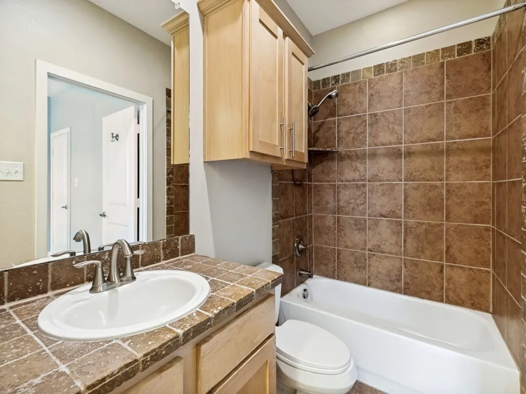 Secondary bedroom ensuite bath in addition to a large walk in closet.