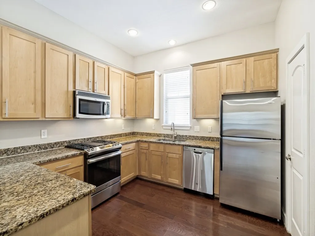 Granite countertops, stainless appliances including refrigerator. Walk in pantry