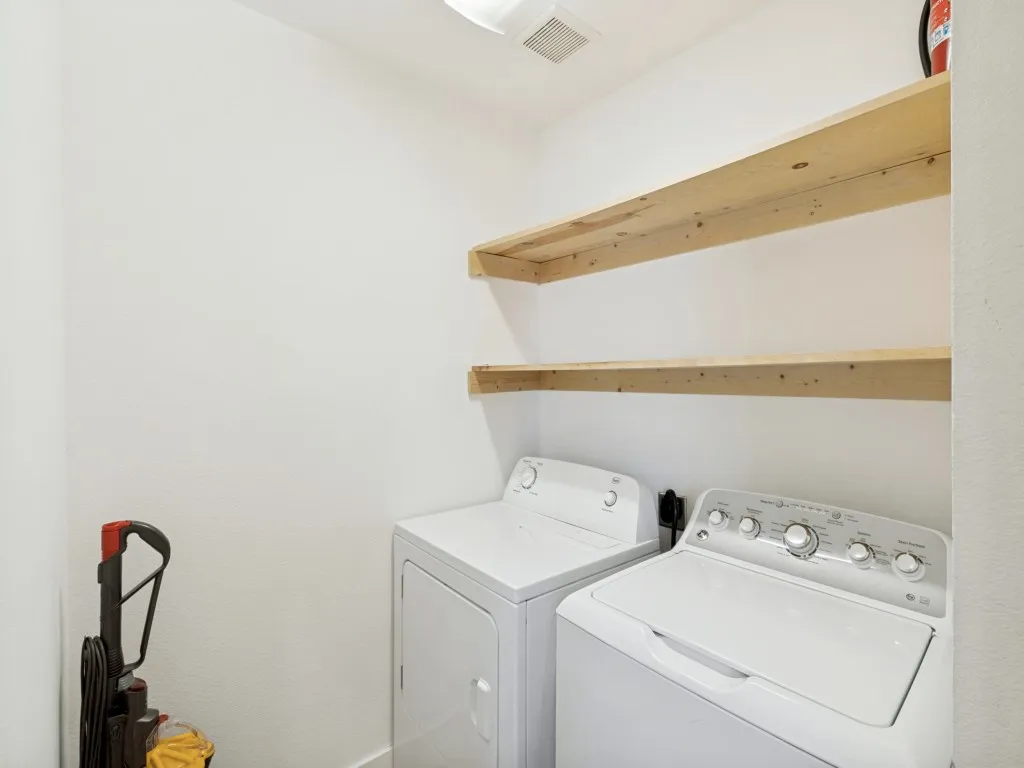 Second floor utility room. Washer and Dryer to remain.