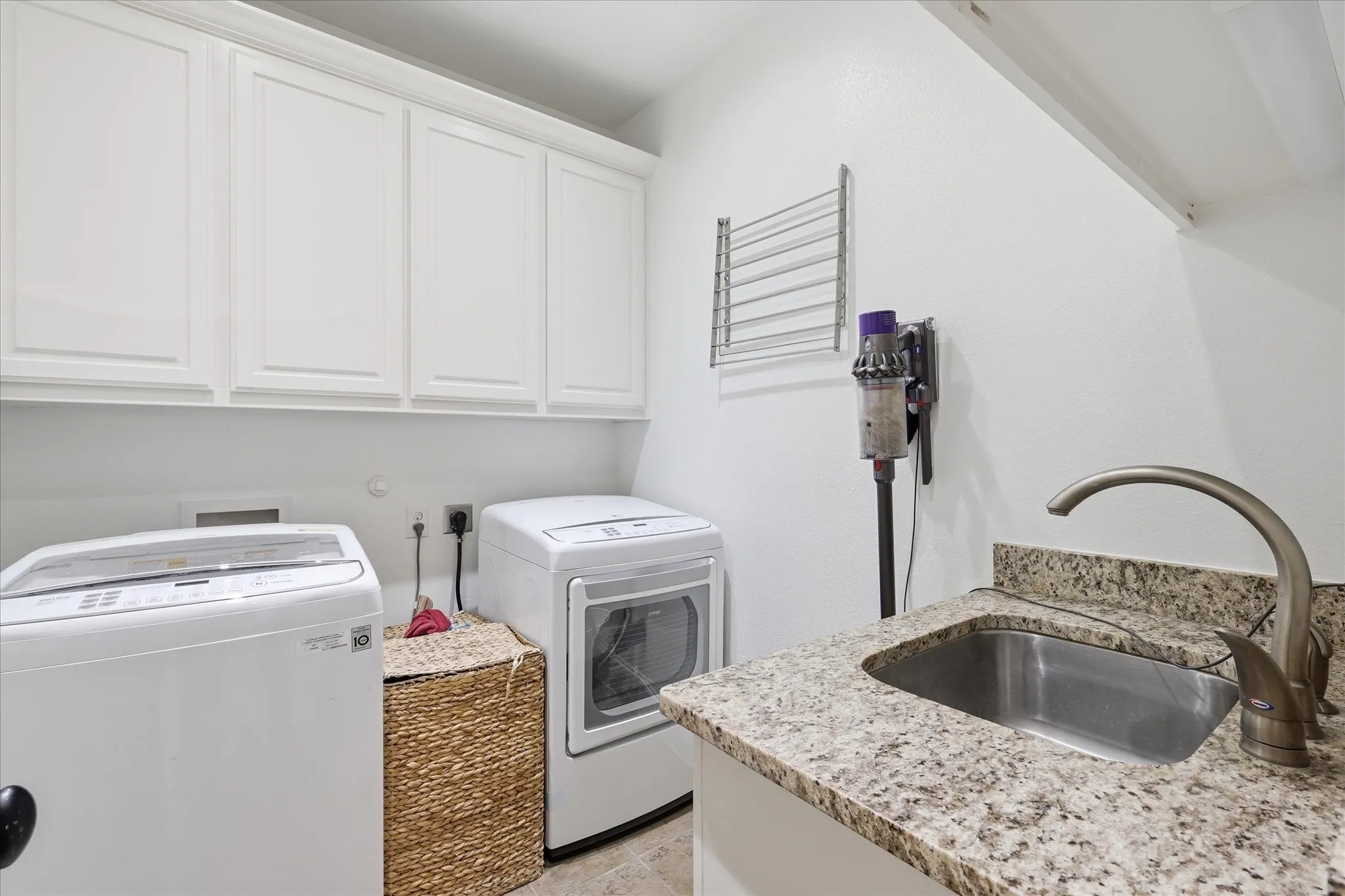 Laundry room with sink.