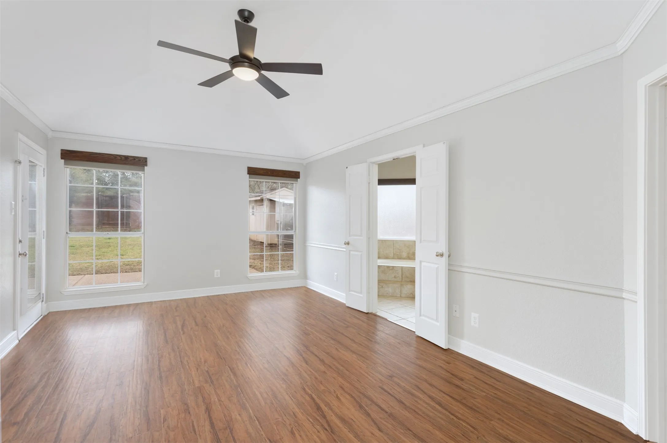 Primary Bedroom with View of backyard