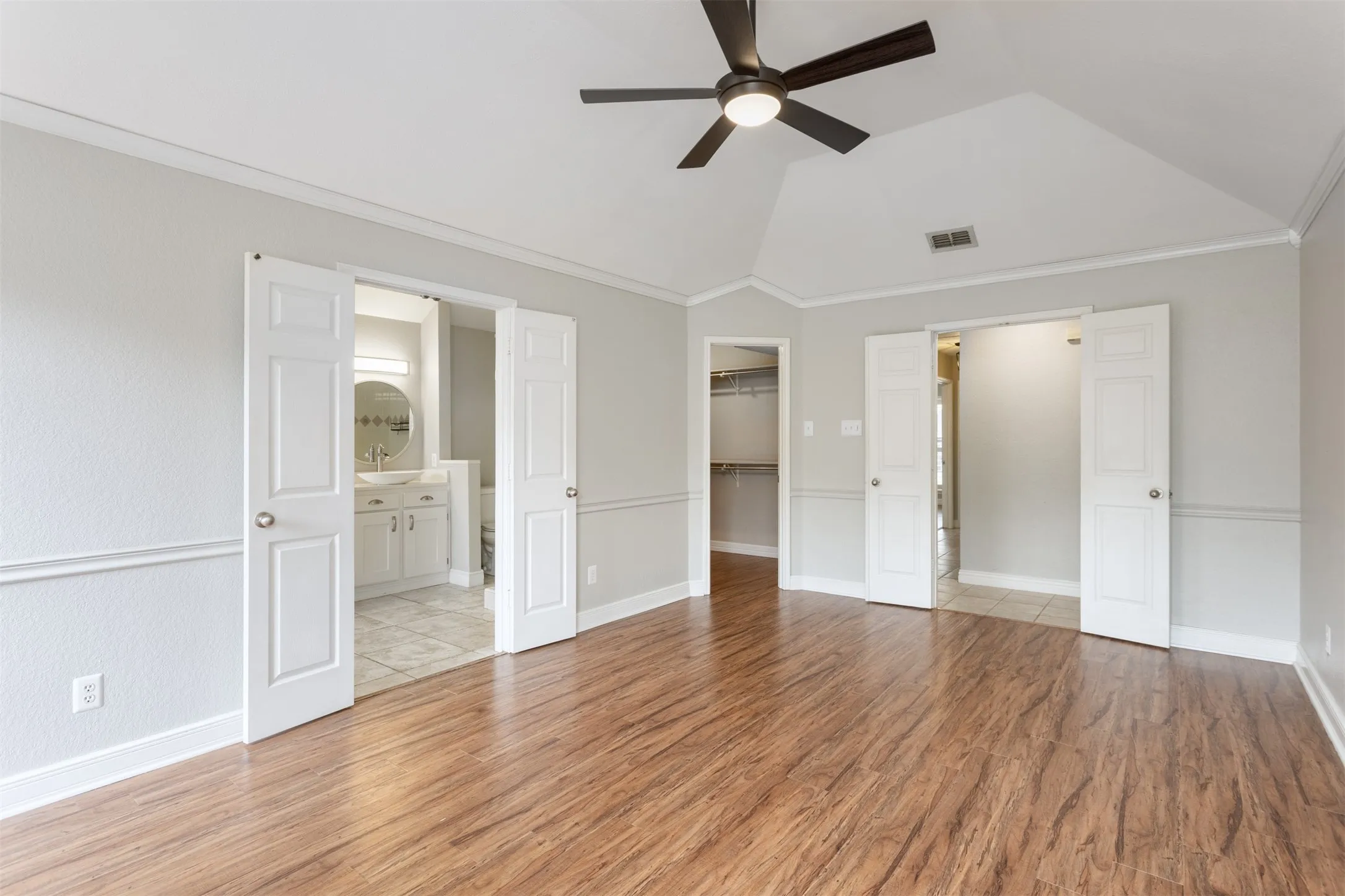 Primary Bedroom with Ensuite Bathroom and Walk-in Closet