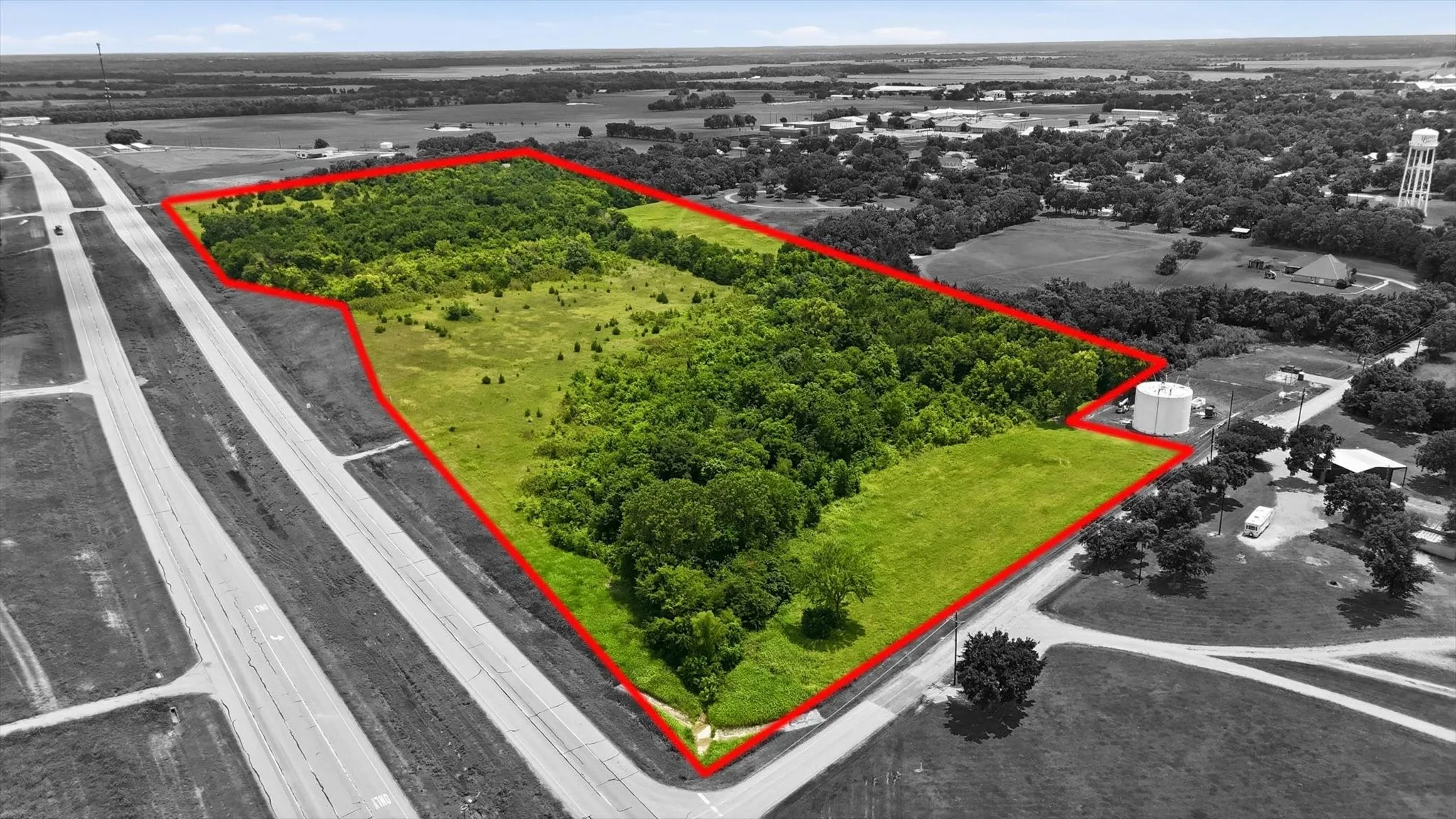 Expansive acreage featuring mature tree lines and open fields