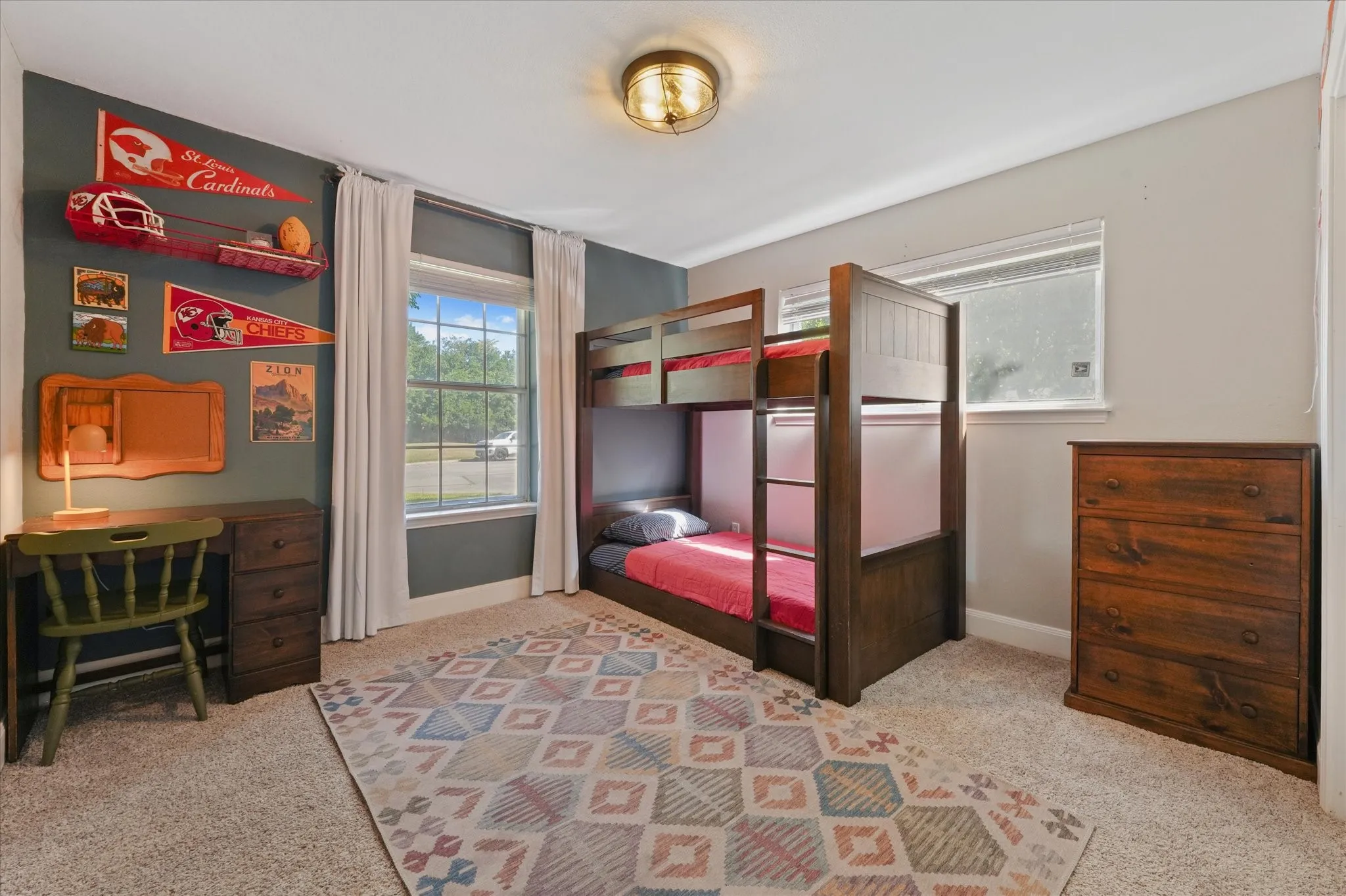 Large secondary bedroom with abundant natural light, updated finishes, and flexible space for growing families or guests.